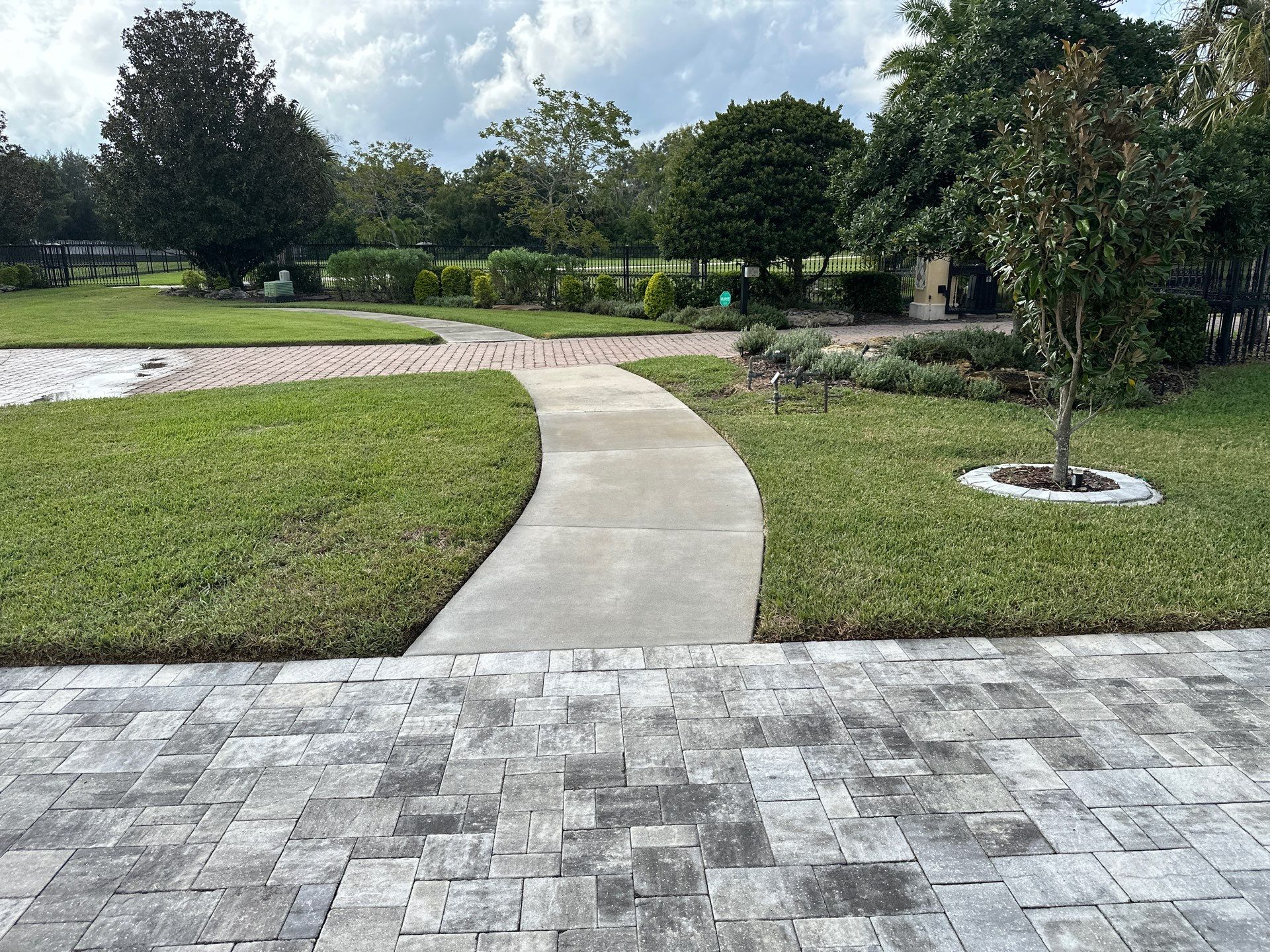 Complete Two-Story House Wash and Driveway Cleaning in Winding River Community, Bradenton, FL by Sunshine AquaWash