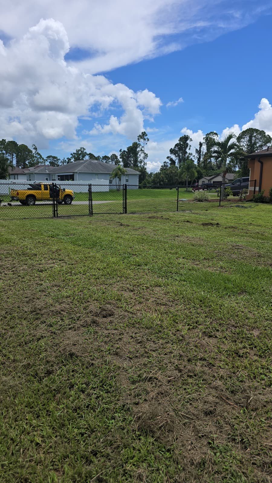 Black Chain Link Perimeter Fencing for North Port Residential Property by True Fence LLC