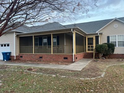 Custom Screened Porch Conversion with New Wood Railing in Dunn