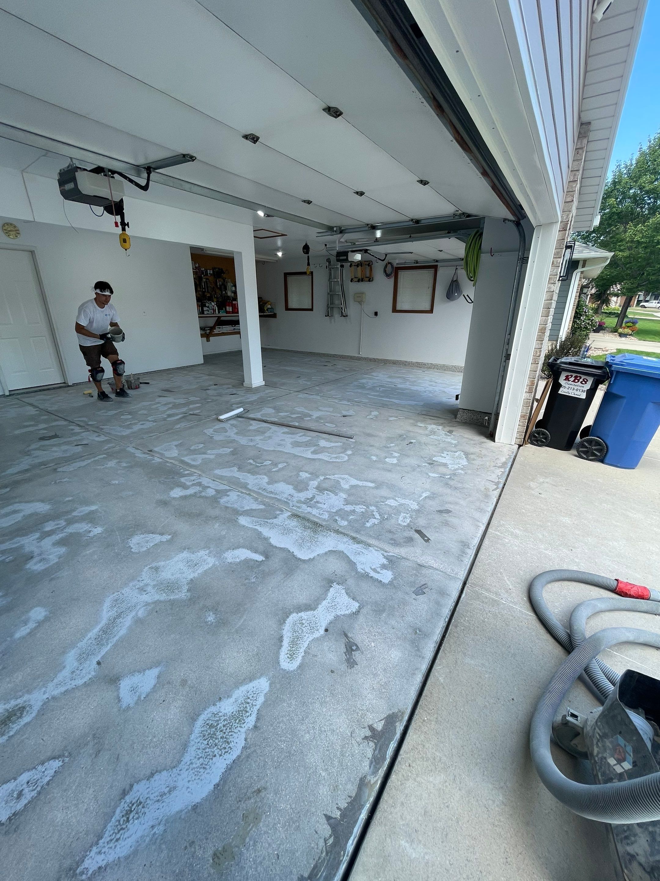 Multi-Car Garage Concrete Coating with Coyote Flake Finish in Sioux Falls by Select Painting, Coatings & Garage Cabinets
