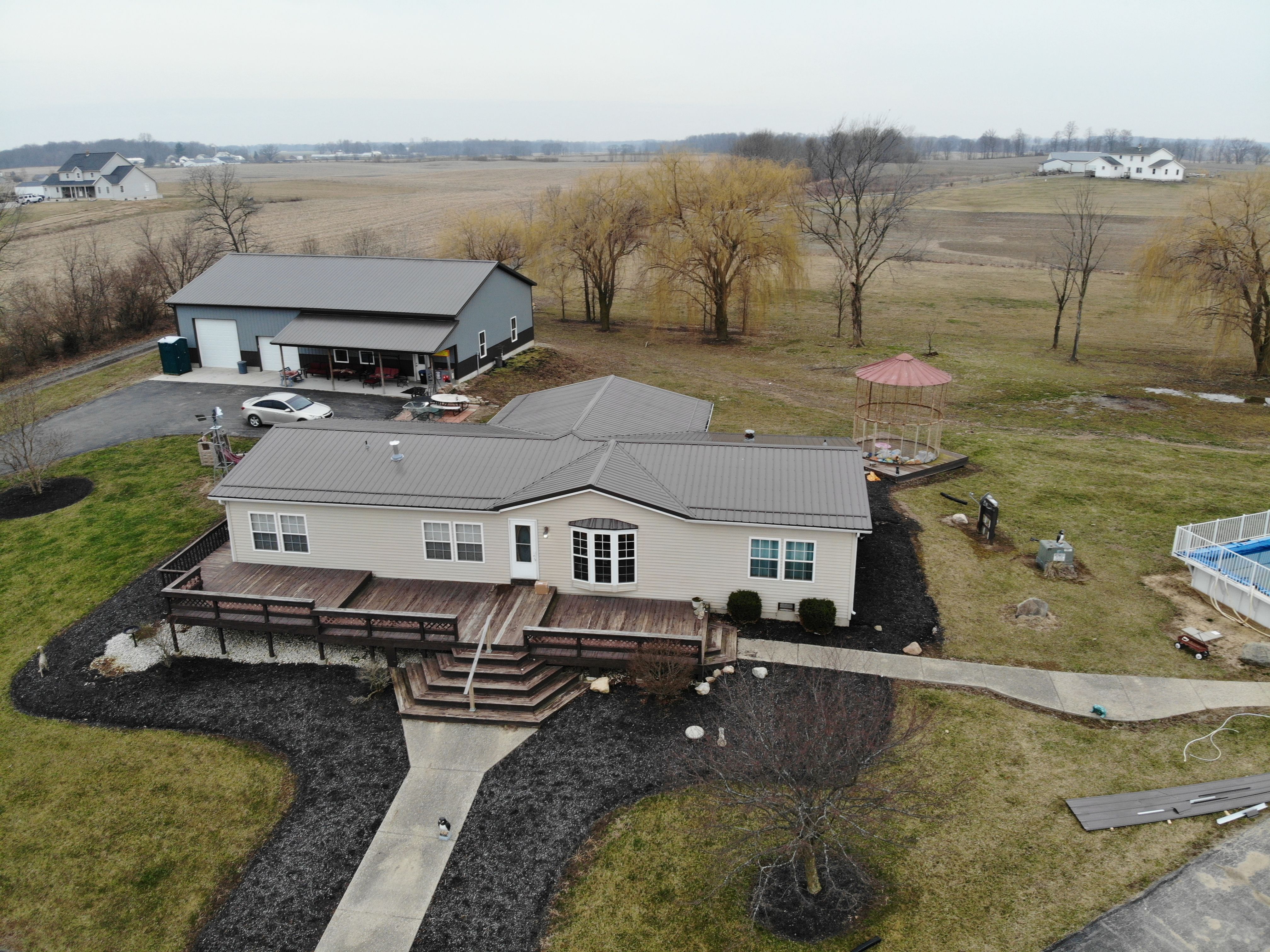 Exposed Fastener Metal Roof on Multi-Home Property in Columbia City, Indiana by 4Ever Metal Roofing