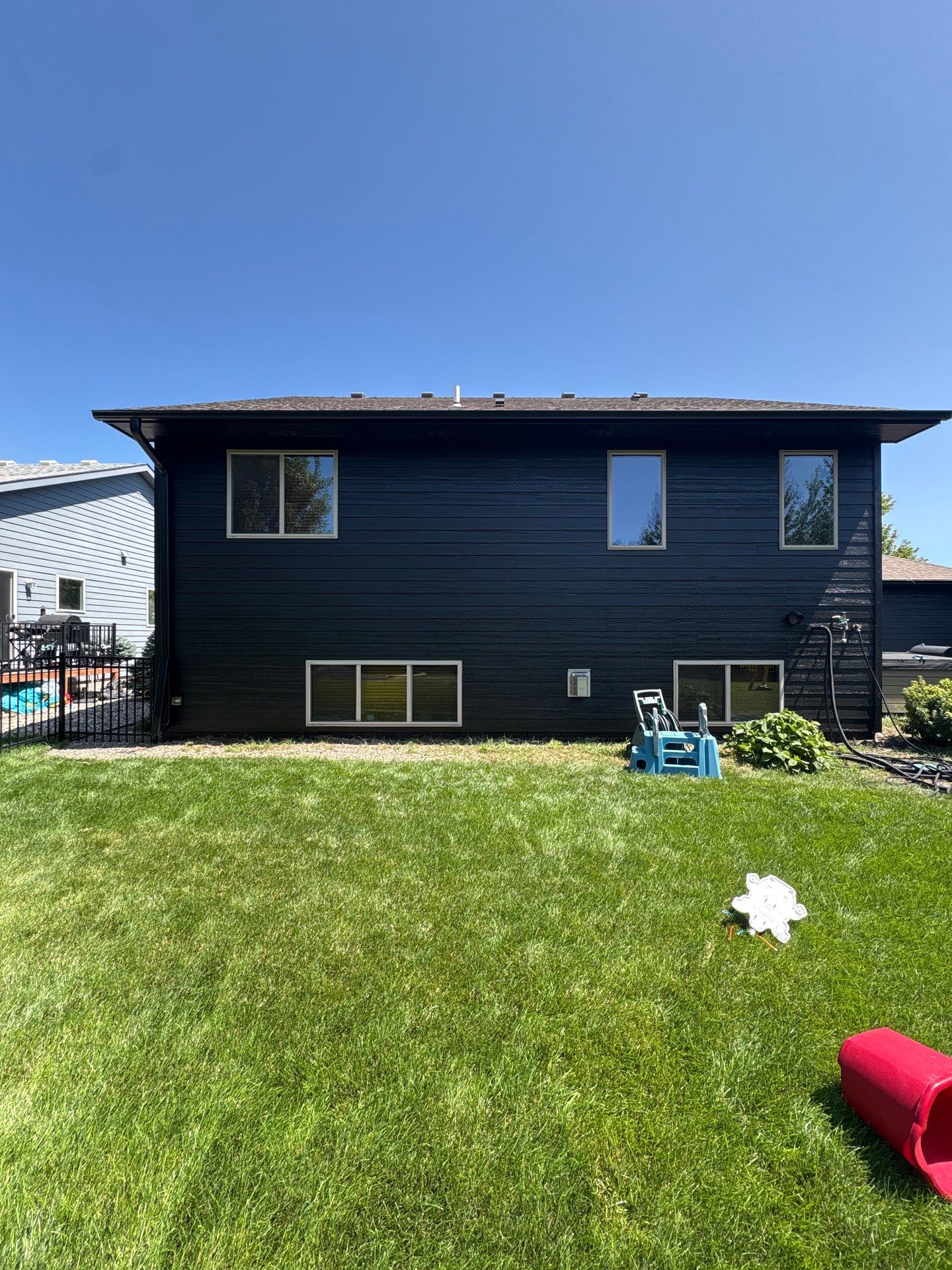 Full Exterior Siding Repaint for Sioux Falls Home and Garage by Select Painting, Coatings & Garage Cabinets