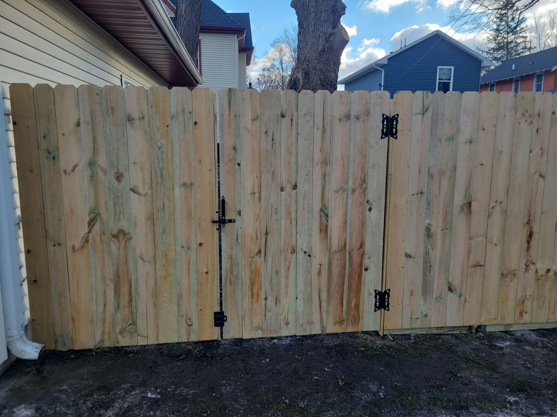 Pressure-Treated Wood Privacy Fence and Double Gate Installation in Waterloo by Perfect Picket Fence and Stain