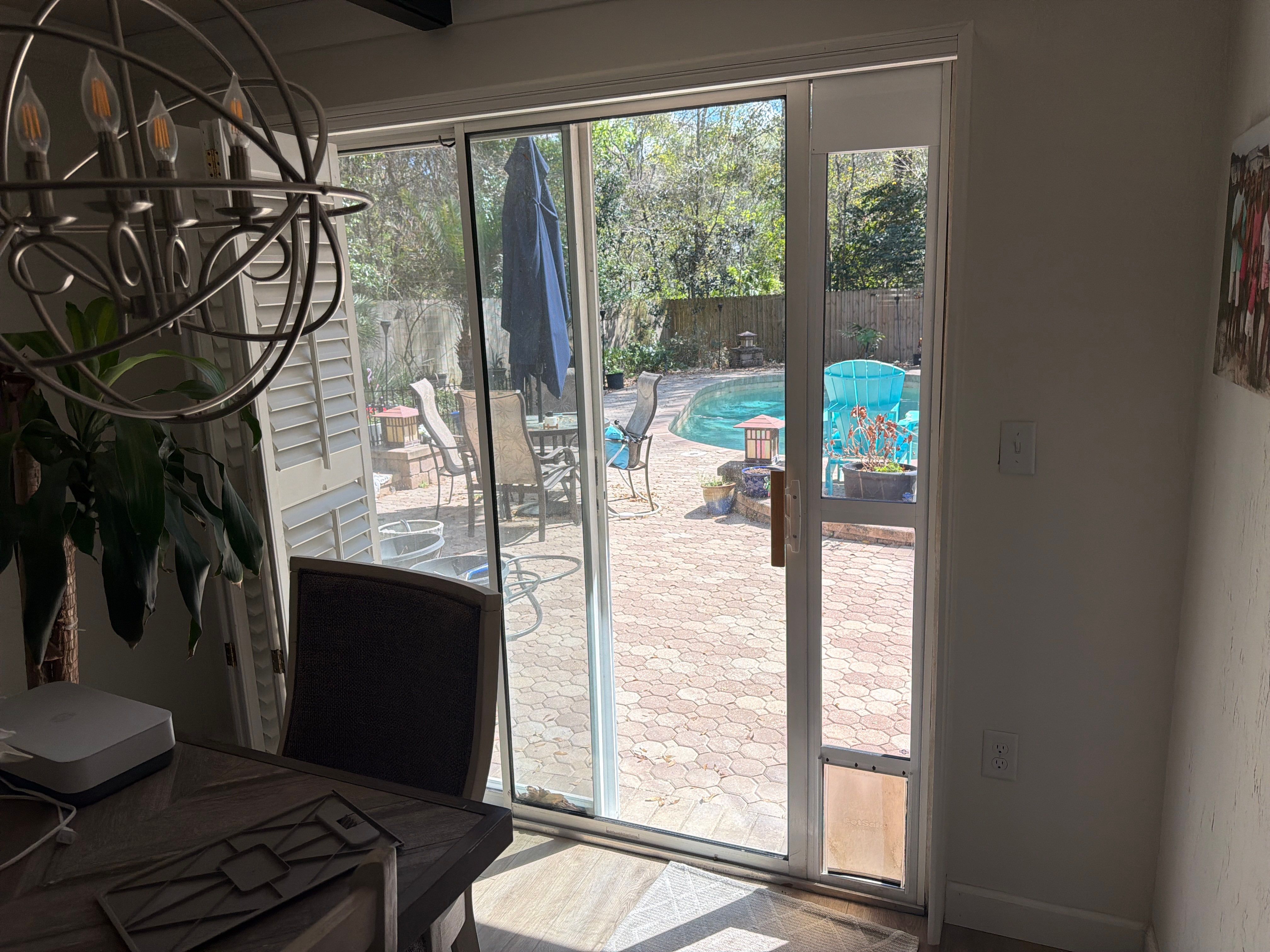 Custom Sliding Glass Door Installation with Integrated Pet Doors in Gainesville by Windows & Doors Store
