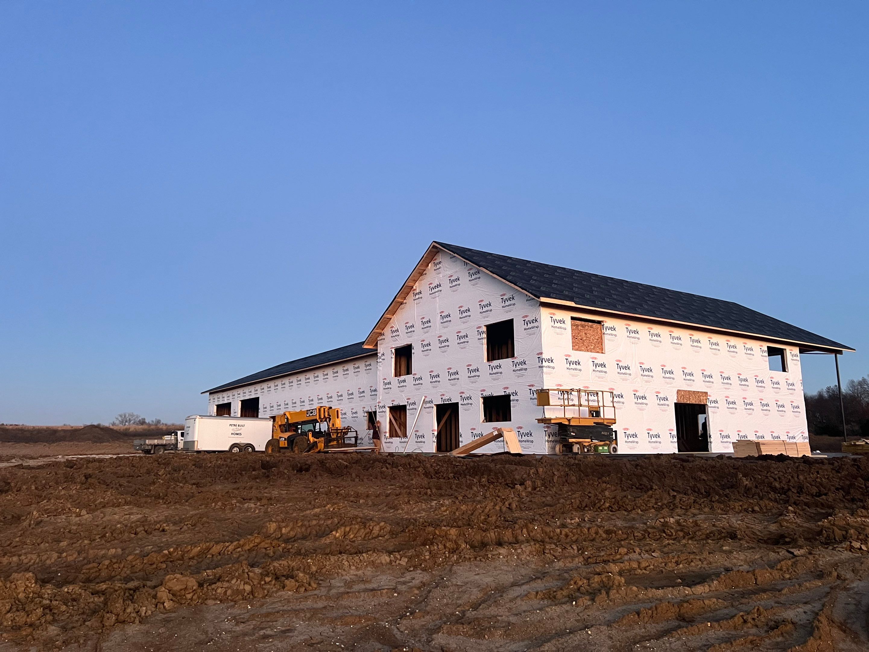 New Home construction w/ board and batten sides and metal roof  by Miles Construction 