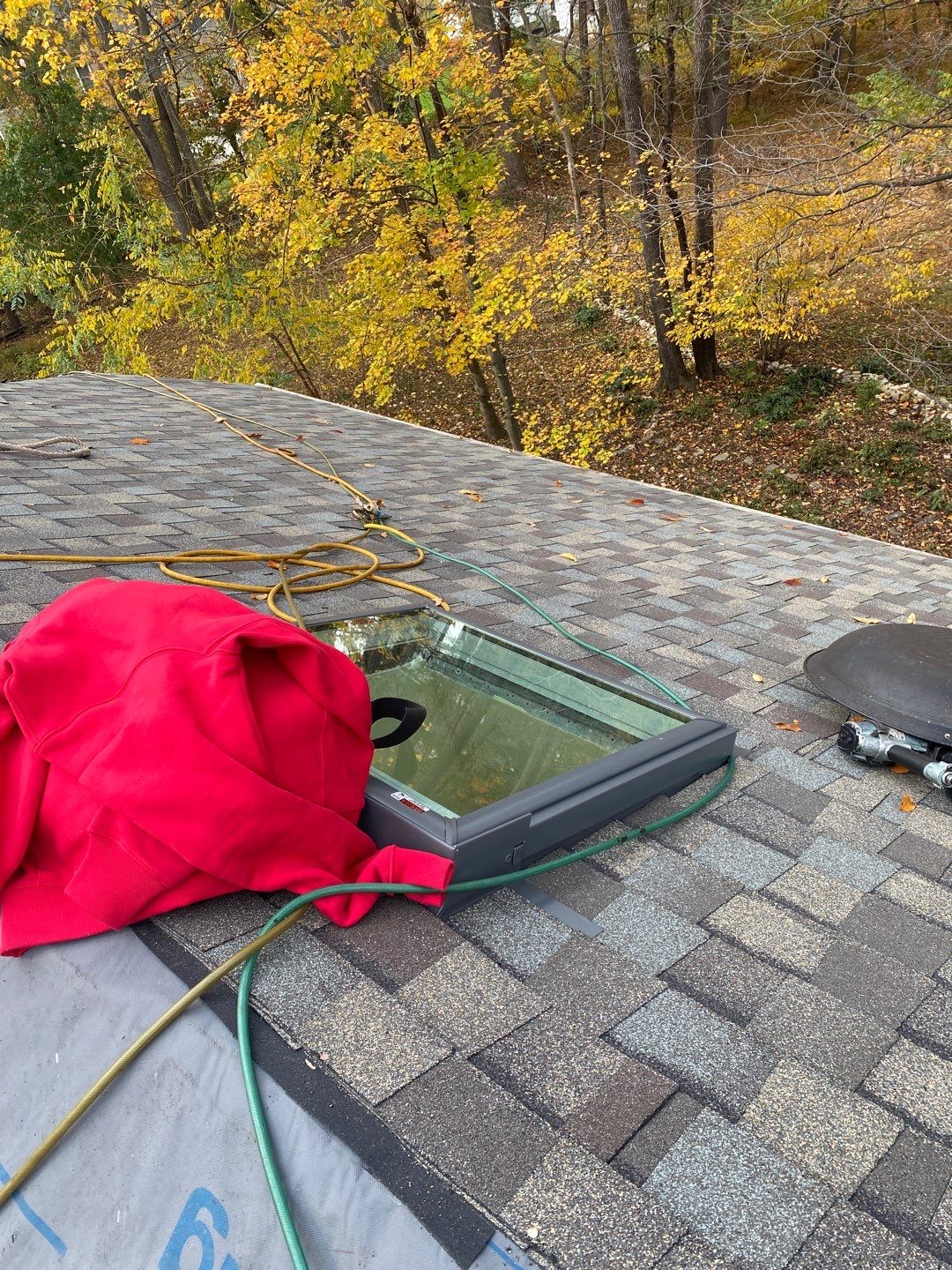 Install new shingles and new skylights  by Alpha Design Services