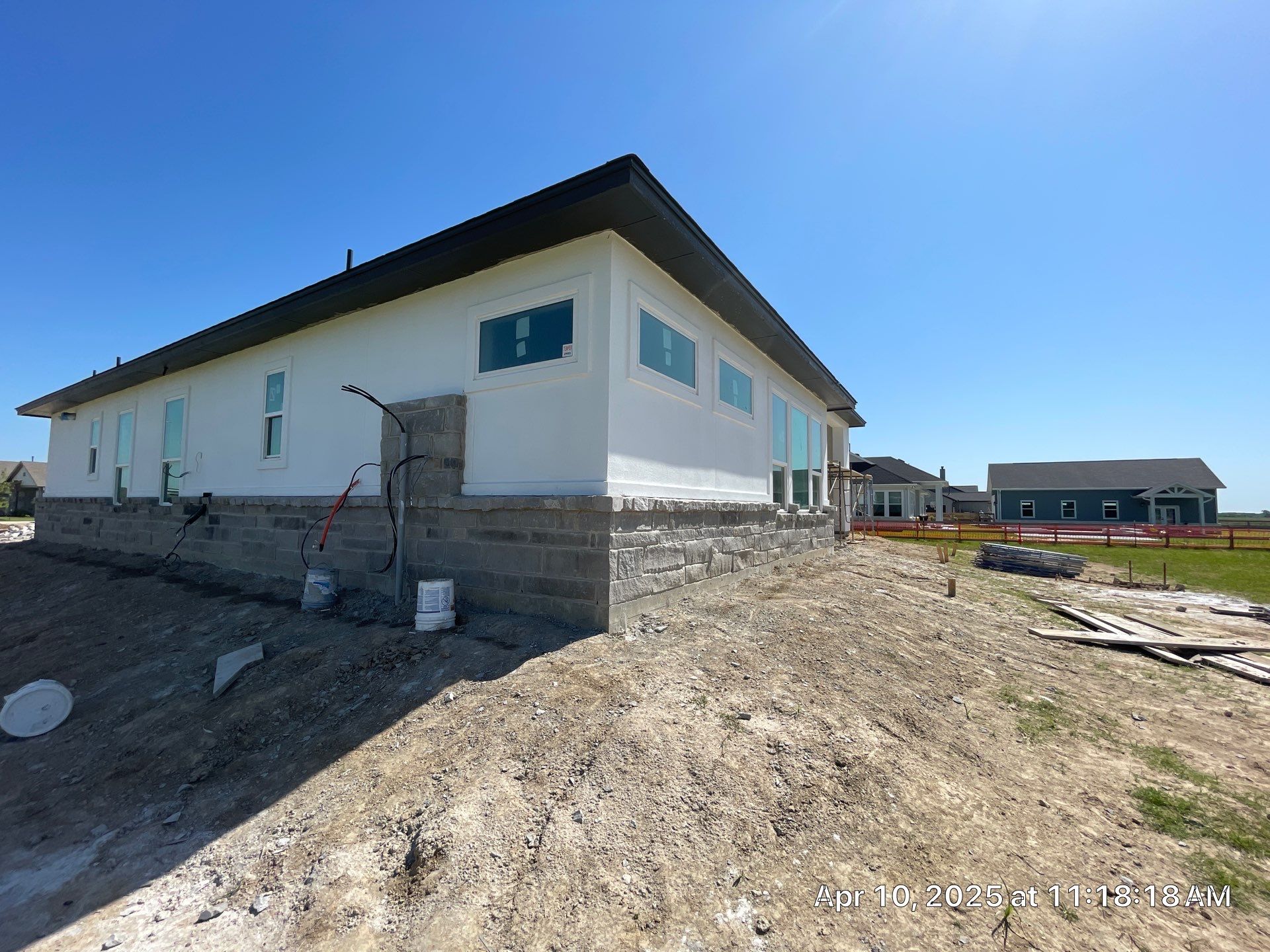 Waller Sophistication: Snowbound Color Stucco with Limestone Accents. by Apex Conventional Stucco Llc