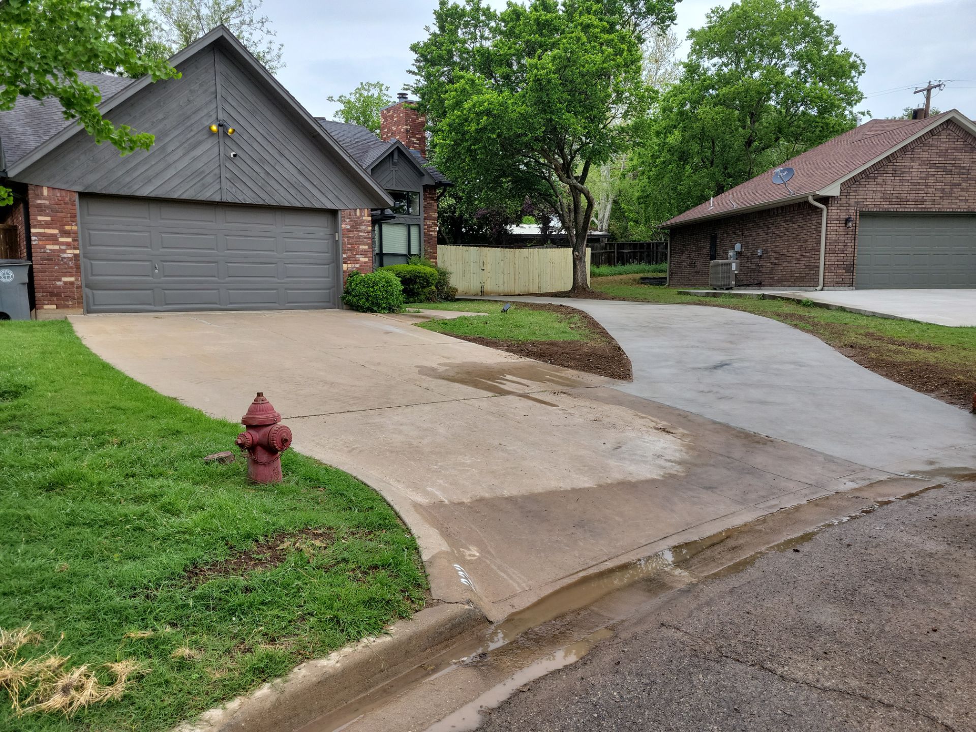 Concrete Driveway and Fence by Clays Services Inc