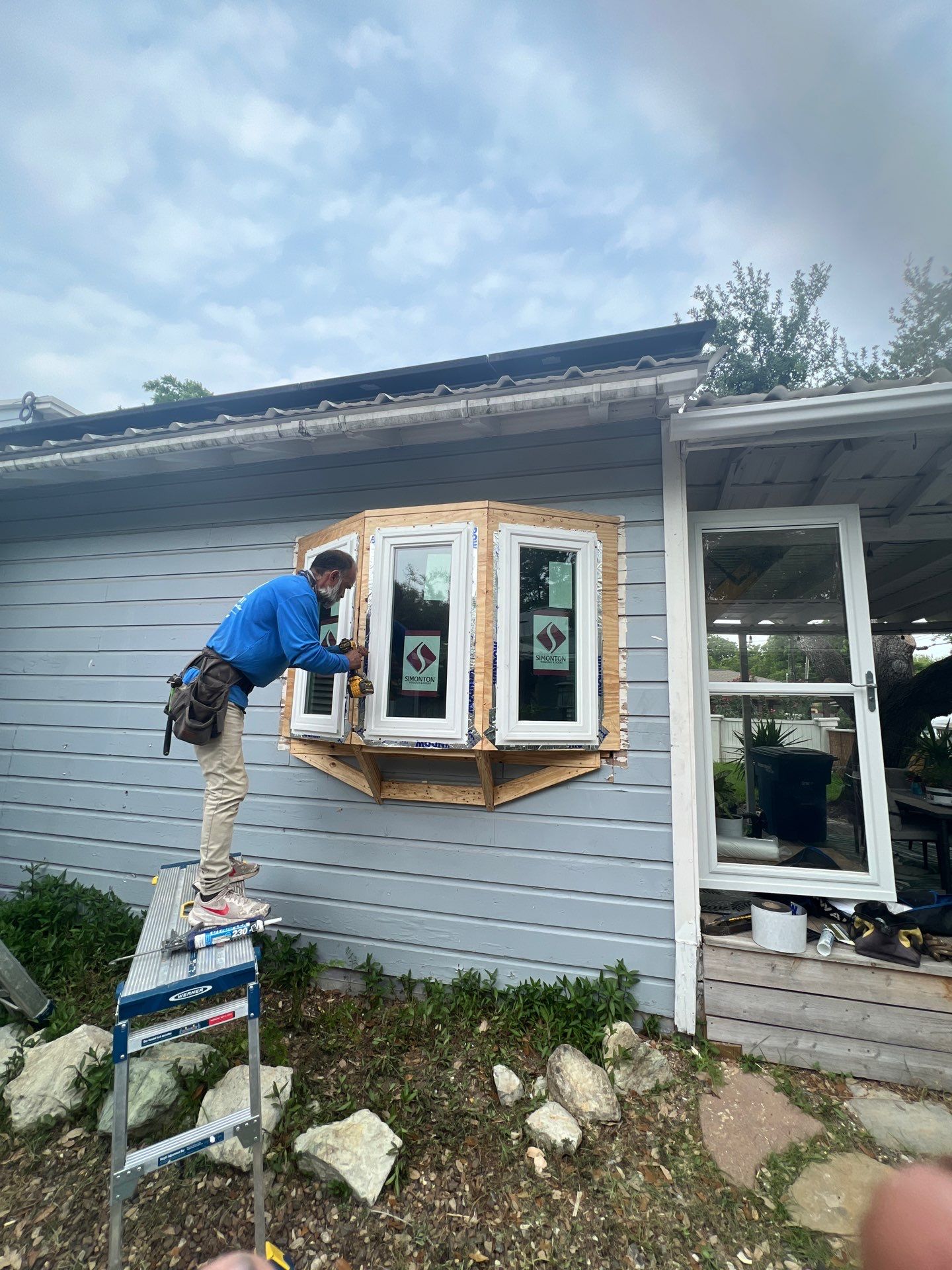 Installing Windows on a Submarine  by Bayfront Roofing and Construction