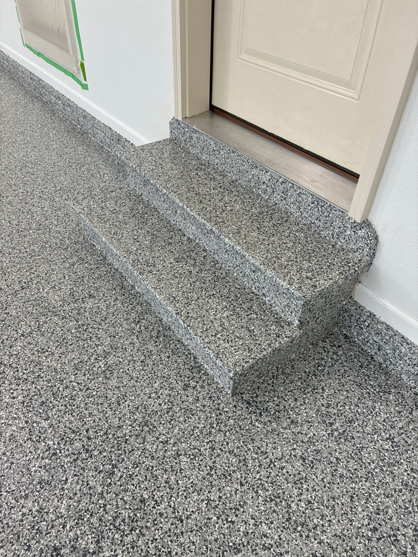 Gray Speckled Epoxy Garage Floor Coating in Grimes by Revival Concrete Coatings