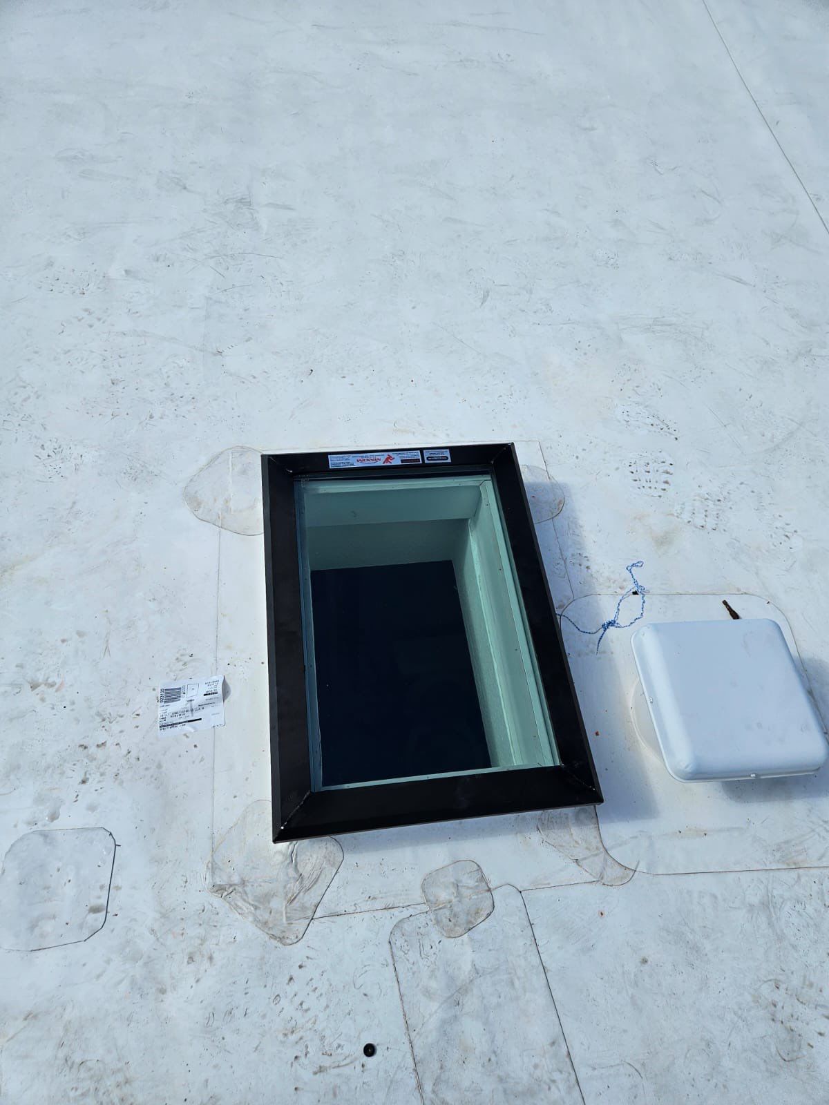 Residential TPO and Skylight Installation by Four Peaks Roofing