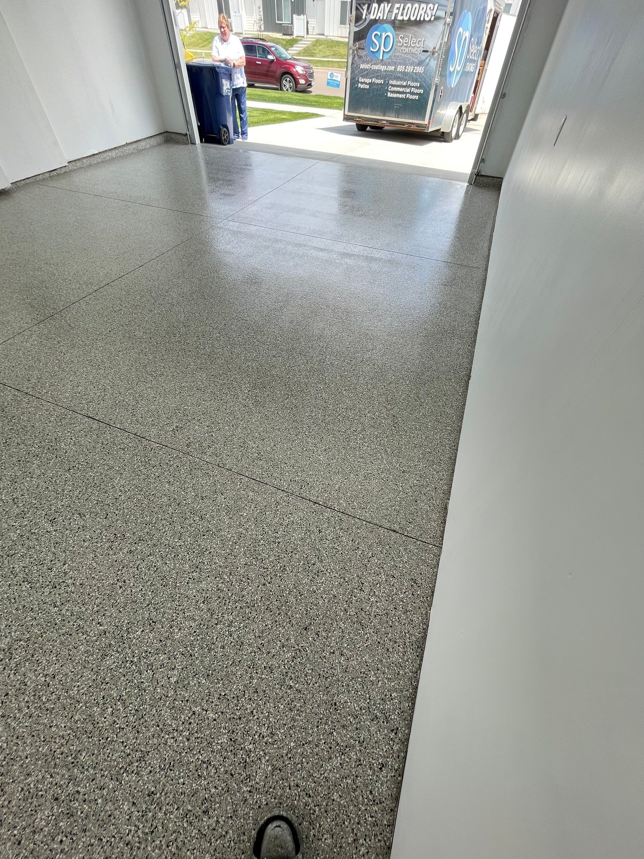 Sioux Falls Garage Floor Transformation with Cabin Fever Decorative Chips by Select Painting, Coatings & Garage Cabinets