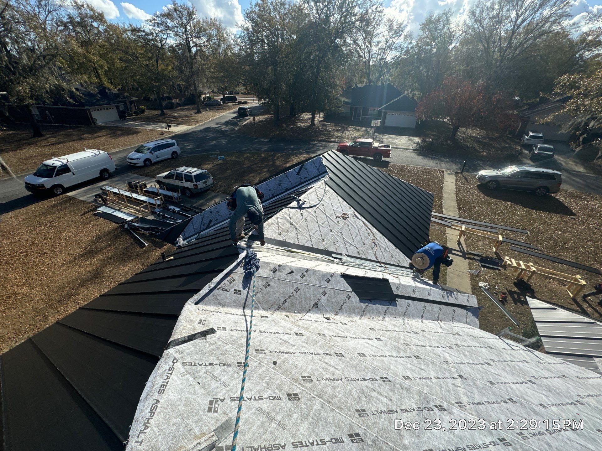 Residential Roofing Installation using Benton 26Ga 1inc Snapcock Metal Roof KYNAR Matte Black by Talya Roofing