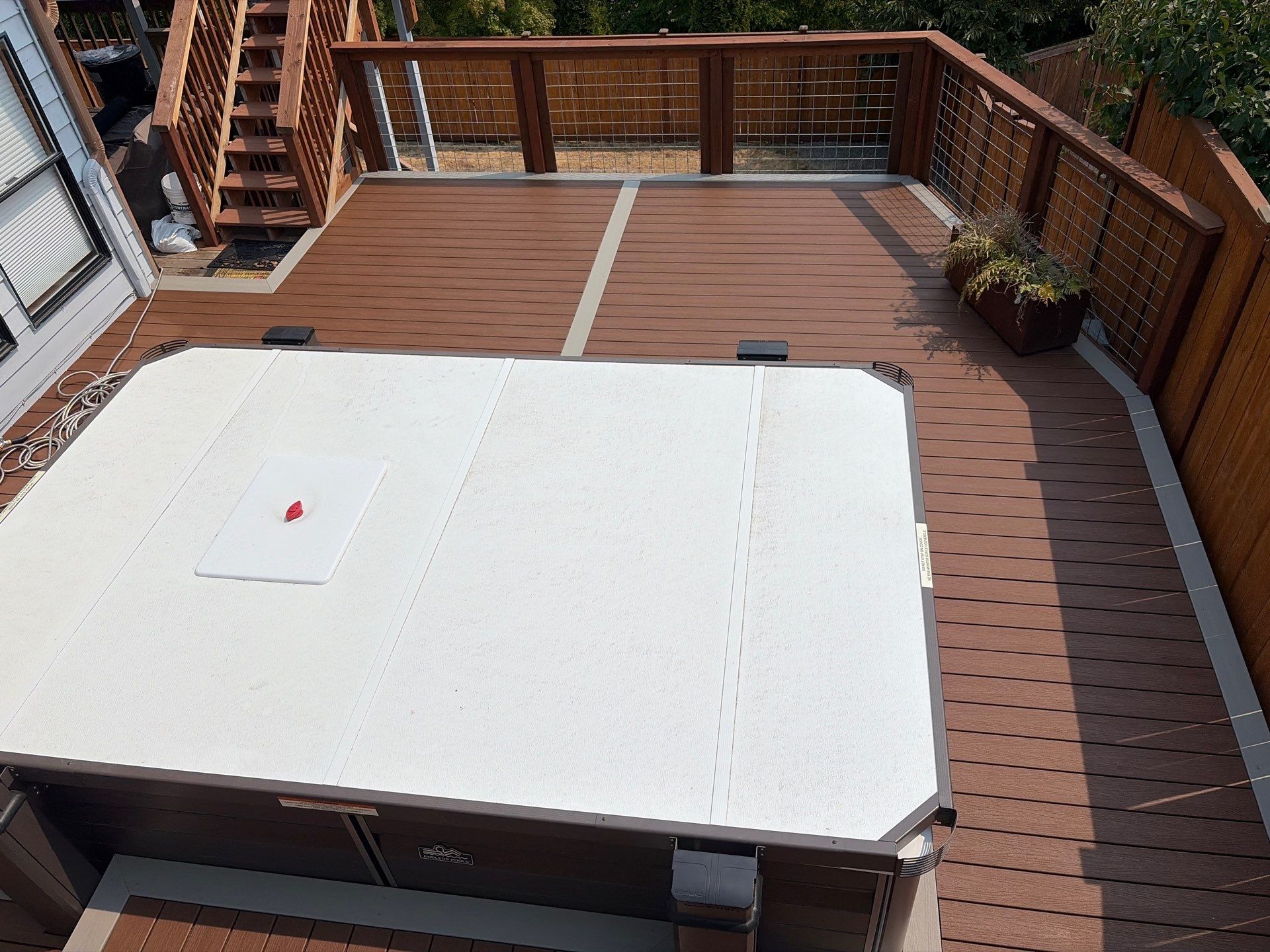 Tacoma Custom Composite Deck and Hot Tub Surround with Retaining Wall by Emerald City Energy 