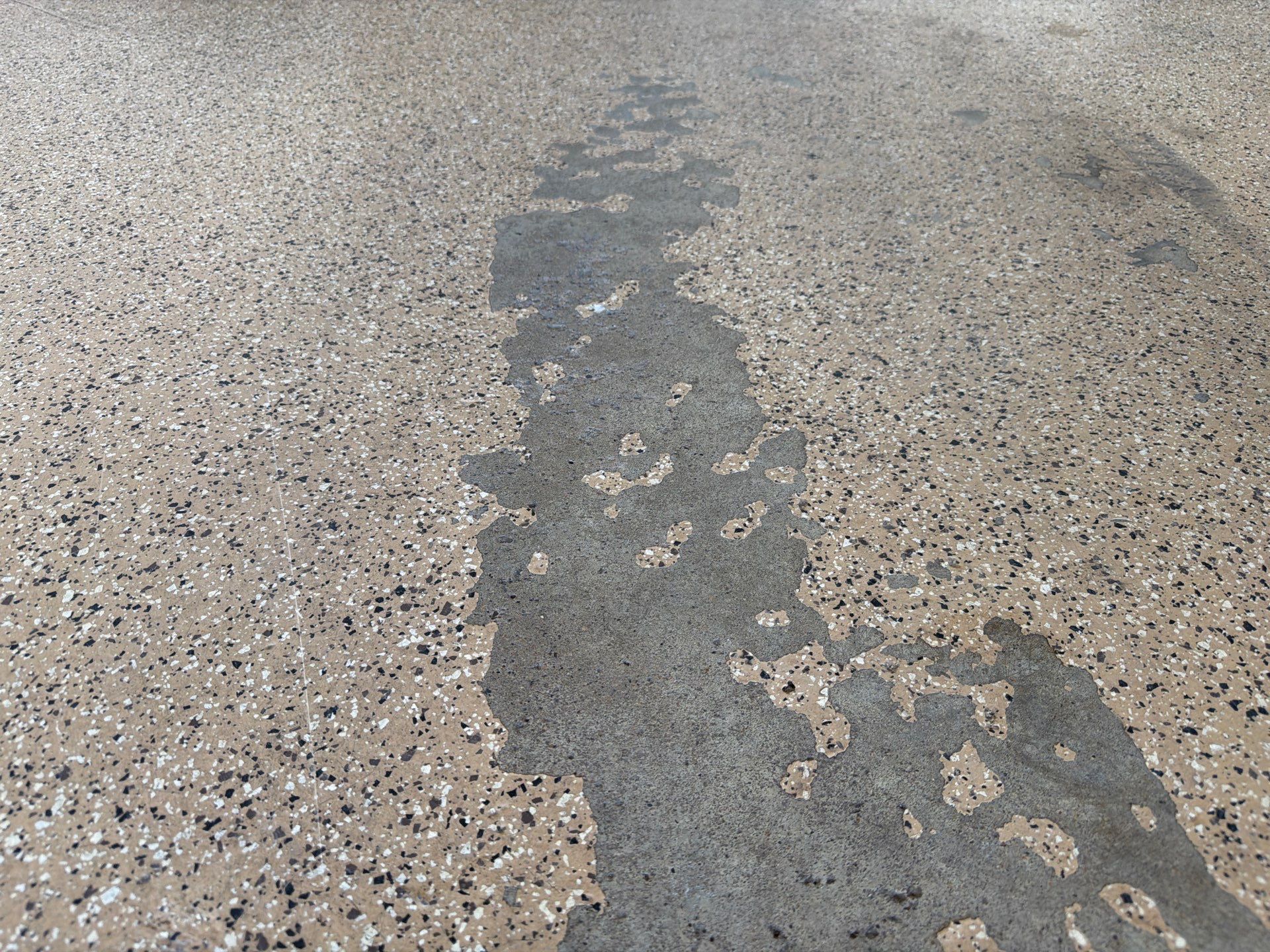 Gray Speckled Epoxy Garage Floor Coating in Sioux Falls by Select Painting, Coatings & Garage Cabinets