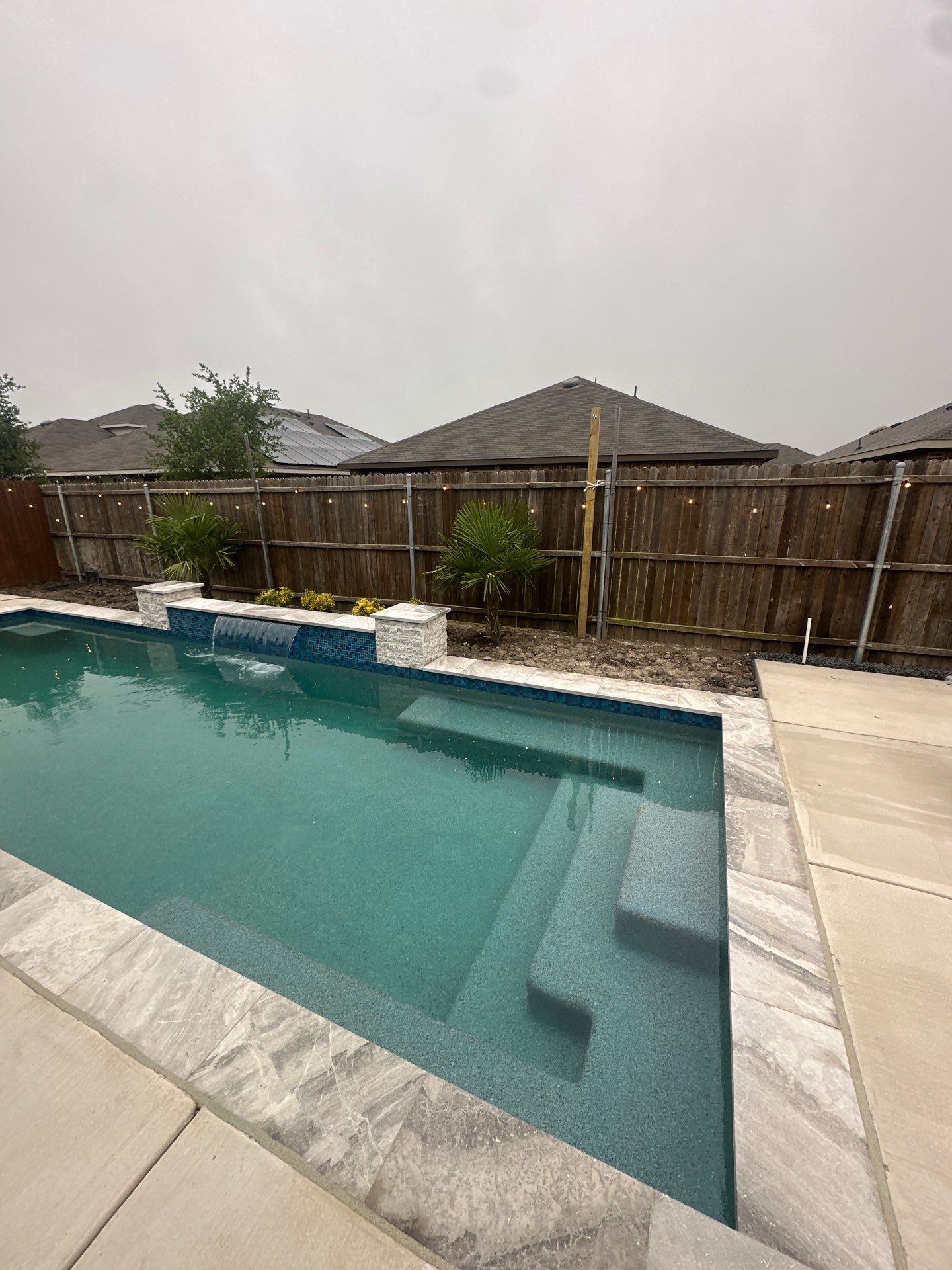Geometric Pool with Raised Fountain Wall by Pinnacle Pools and Spas - DFW