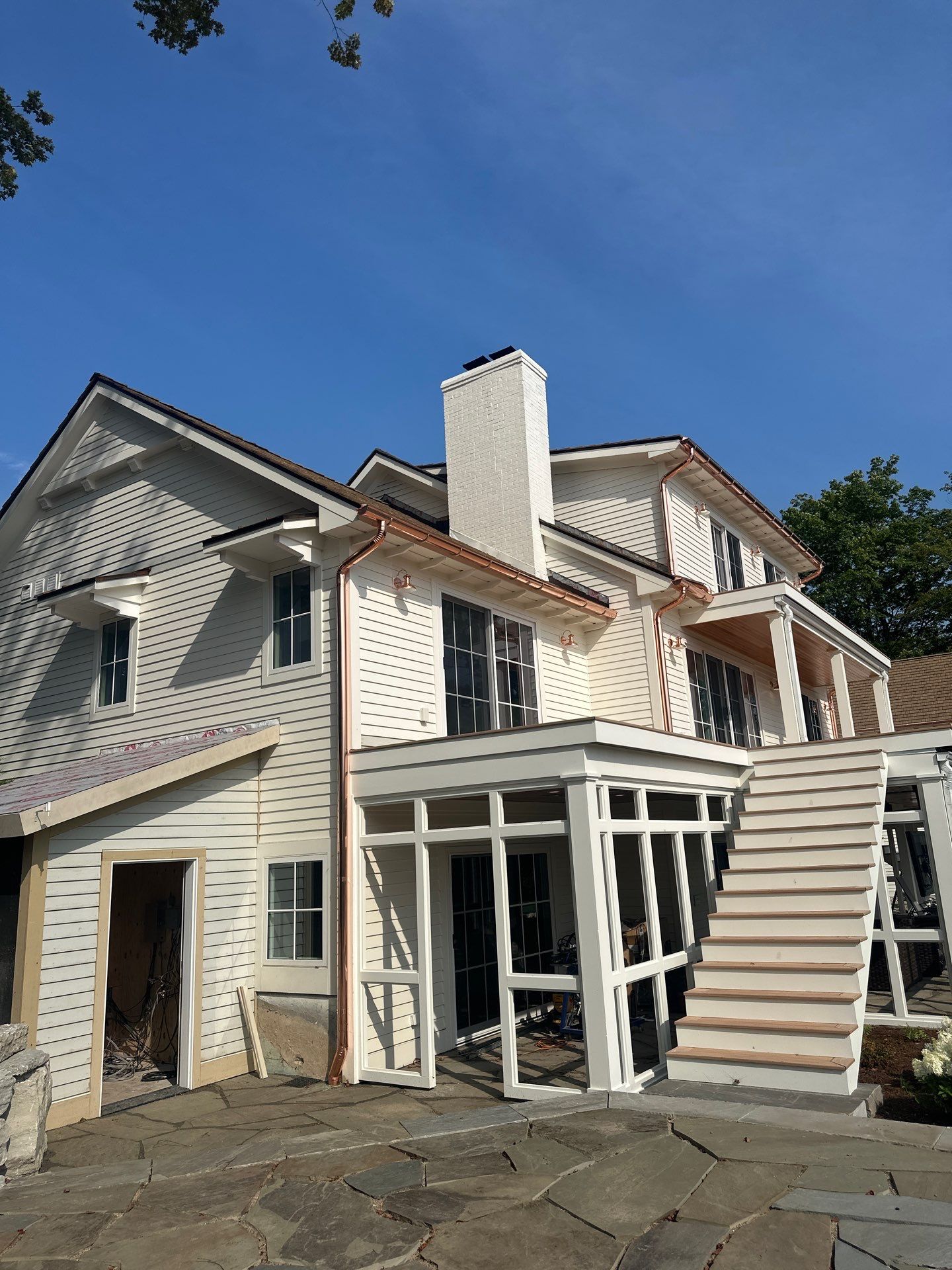Custom Copper Gutter System and Accent Roofing in East Jordan by Rainbow Seamless Systems