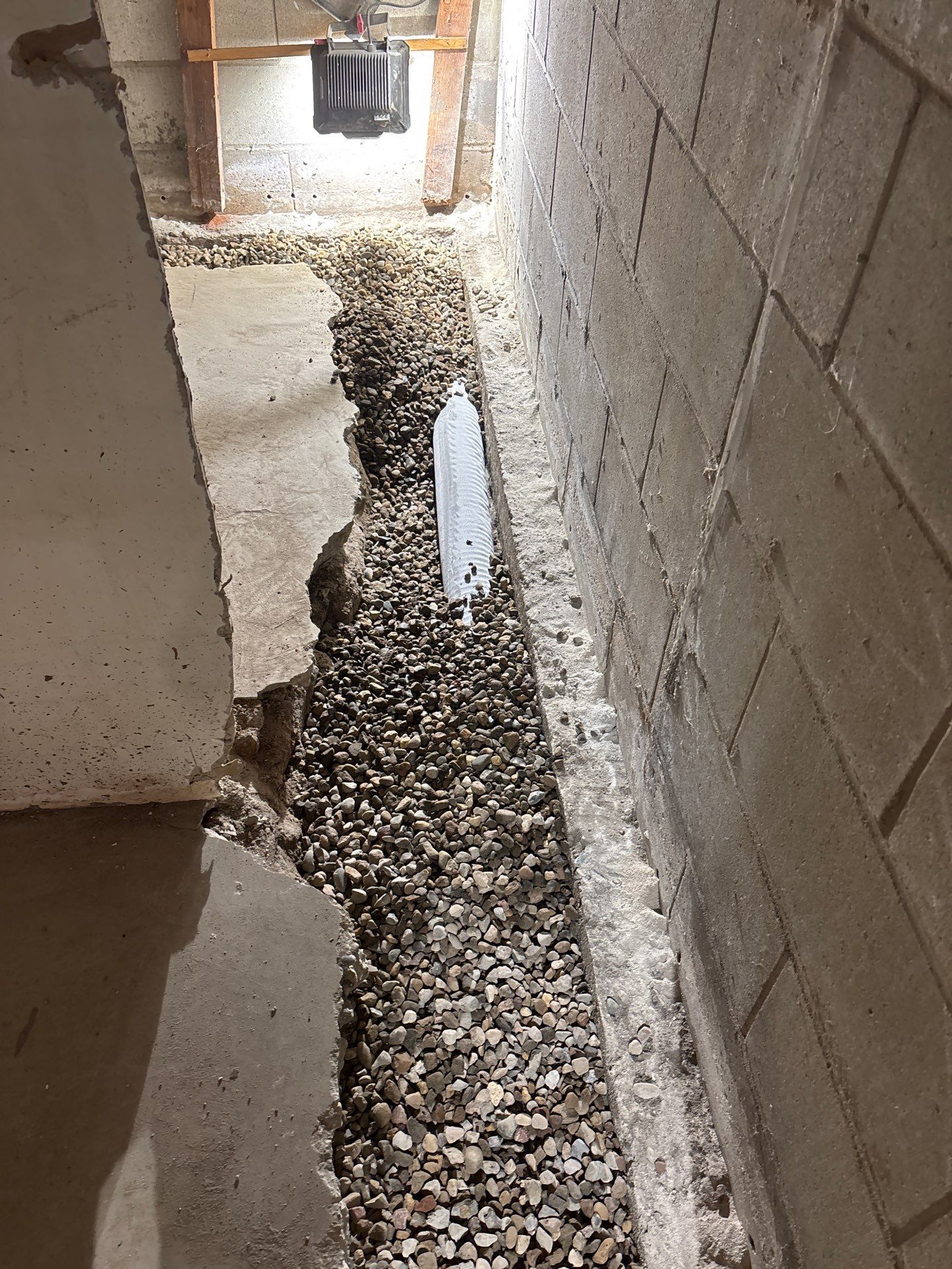 Interior Drain Tile & Buried Discharge in South Minneapolis by Waterproofing Northeast
