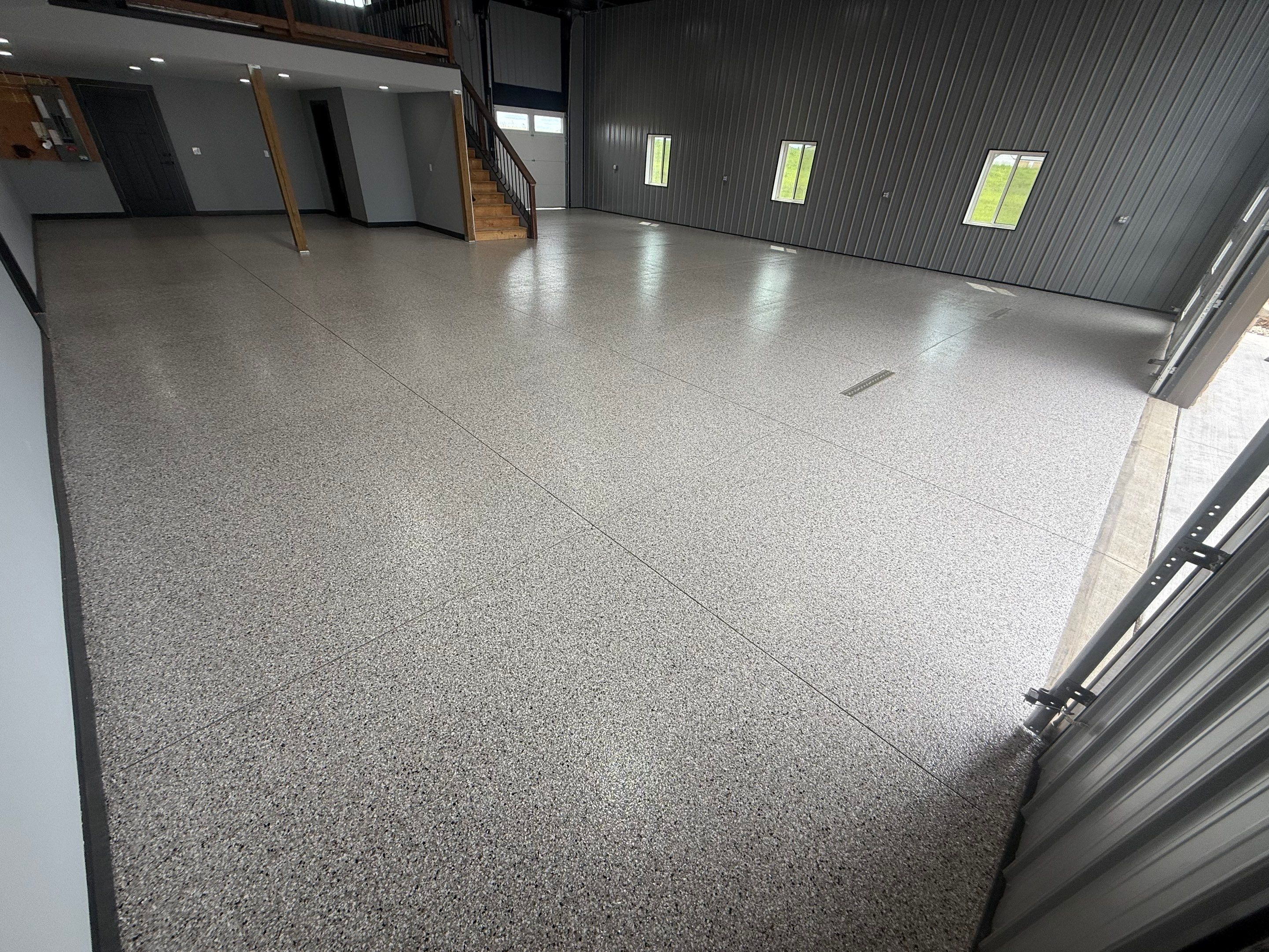 Polyaspartic Garage Floor Coating with Decorative Flake in Wentworth by Select Painting, Coatings & Garage Cabinets