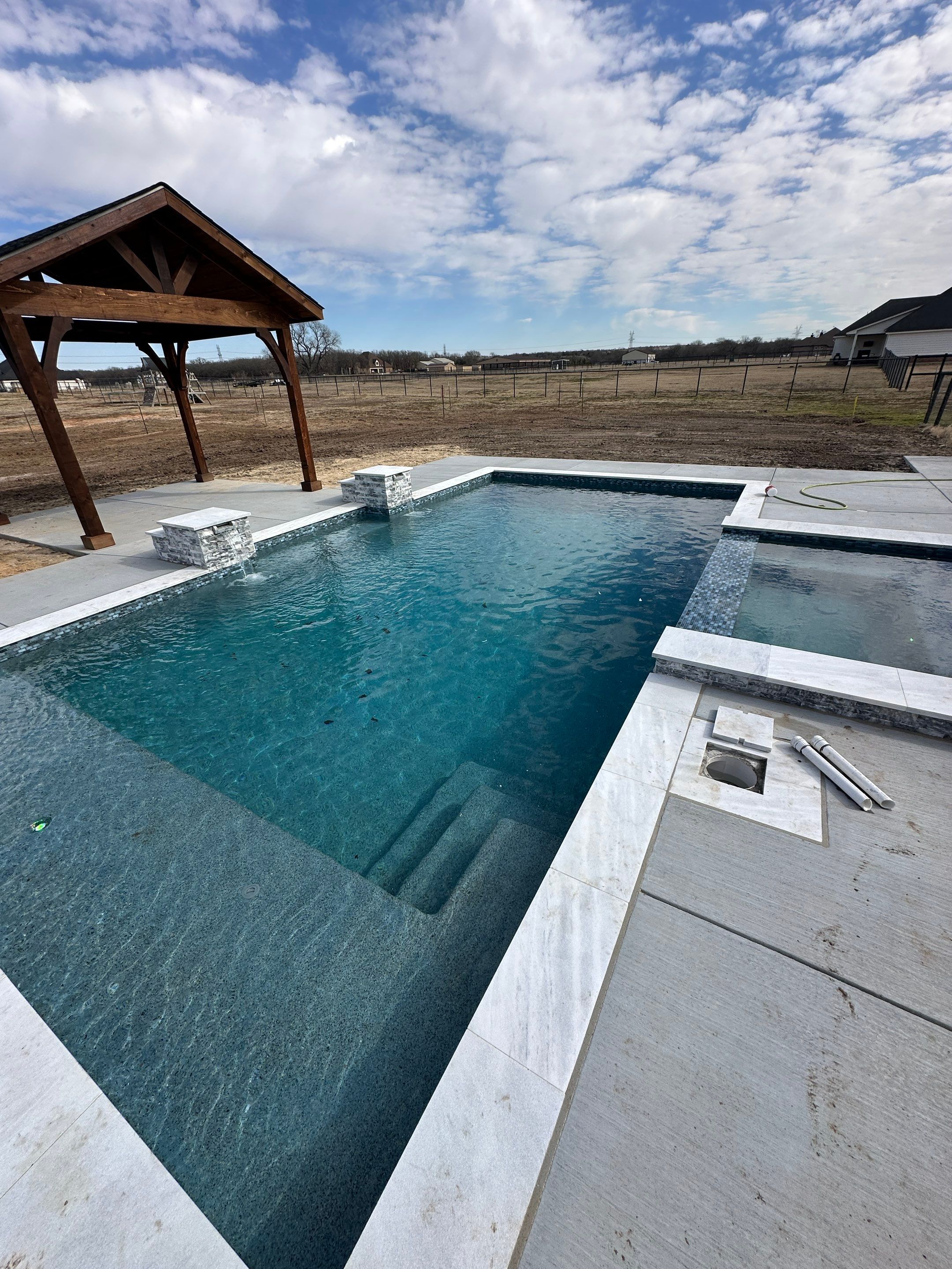 Geometric Pool with Tanning Ledge and Cedar Pergola by Pinnacle Pools and Spas - DFW