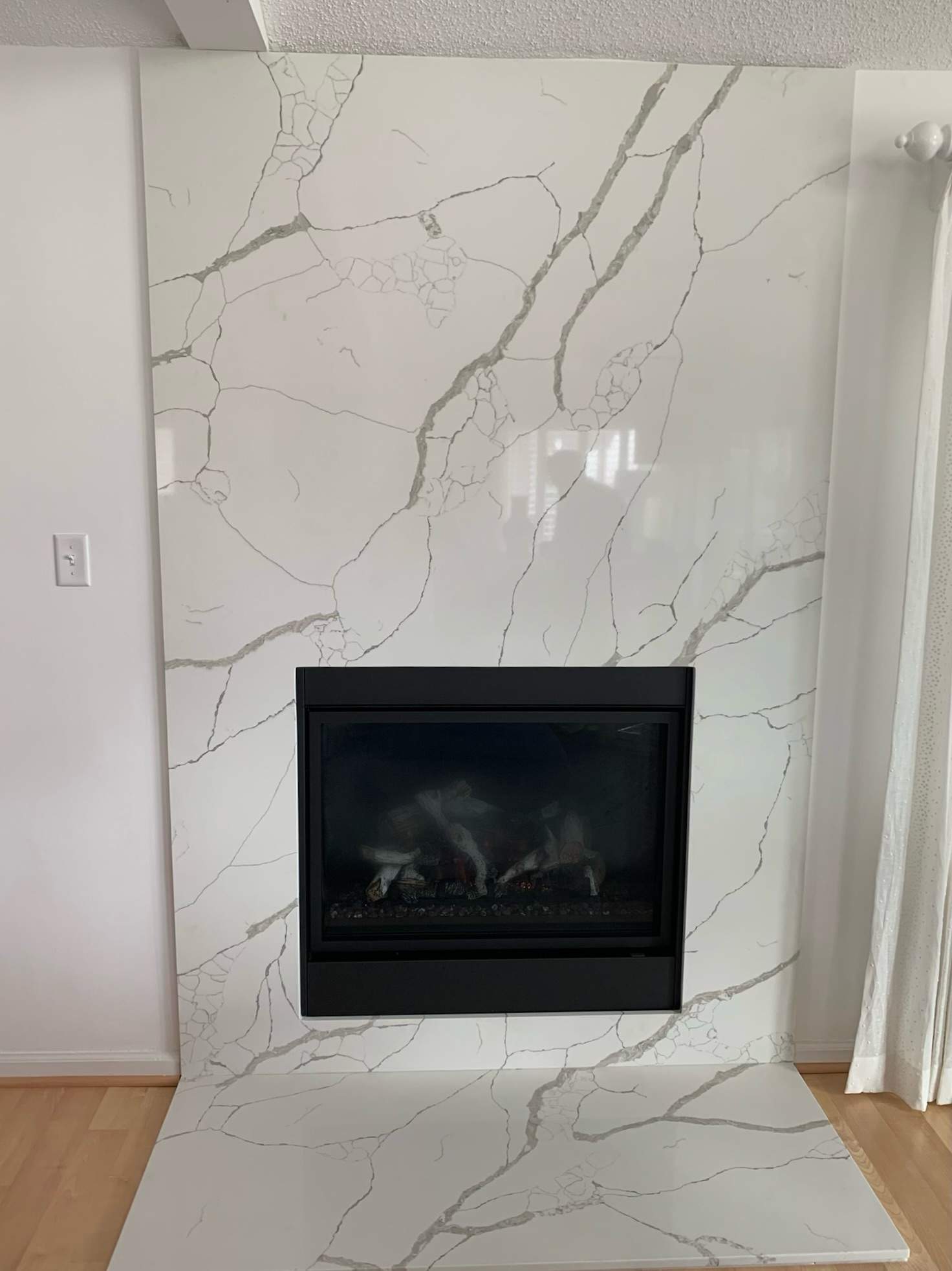 Direct Vent Gas Fireplace with Custom Stone Slab by Premier Chimney and Roofing