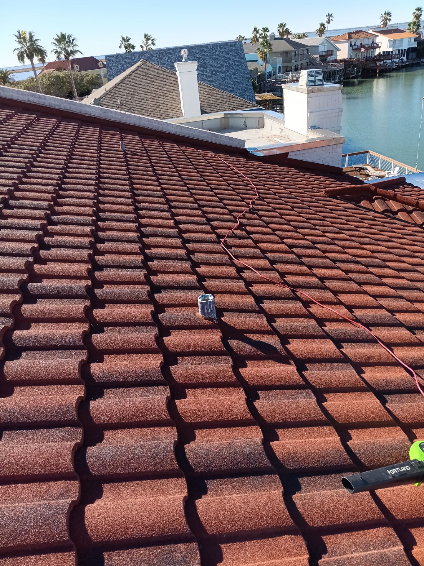 Off with the Tile and on with the TILCOR stone coated metal.  by Bayfront Roofing and Construction