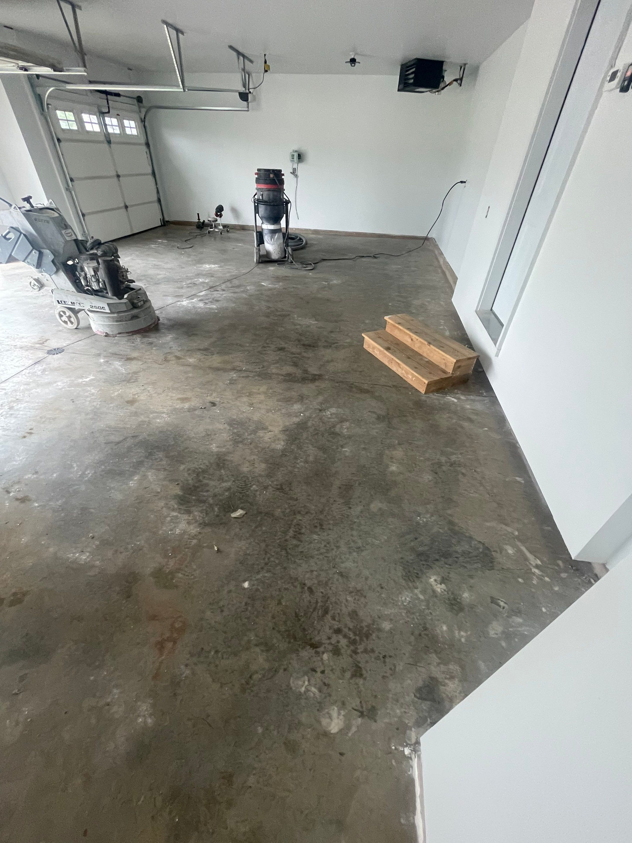 Grey Flake Epoxy Garage Floor Coating in Sioux Falls by Select Painting, Coatings & Garage Cabinets