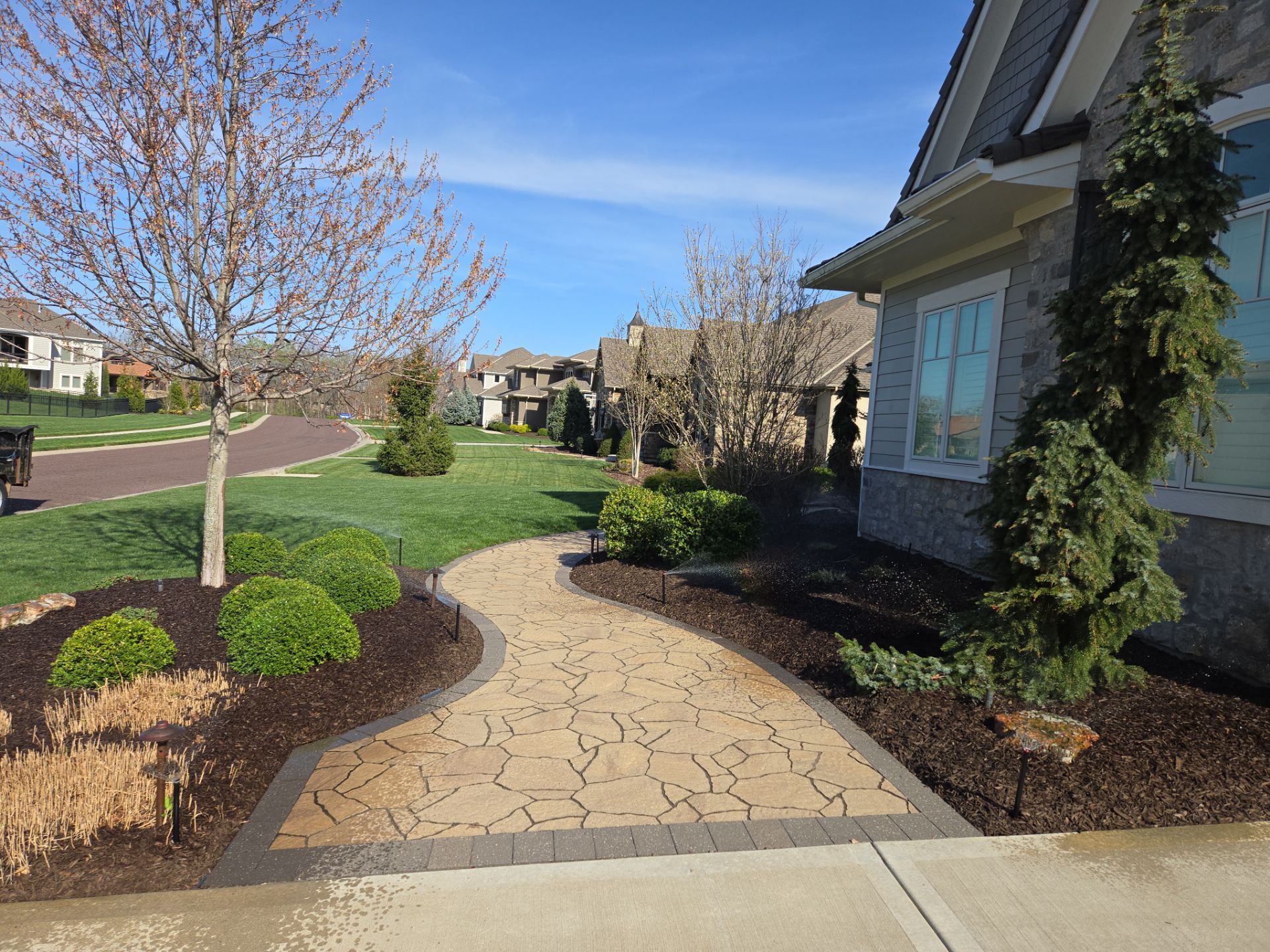 Front Yard Landscape and Walkway Renovation in Overland Park by LAND ESCAPES LLC