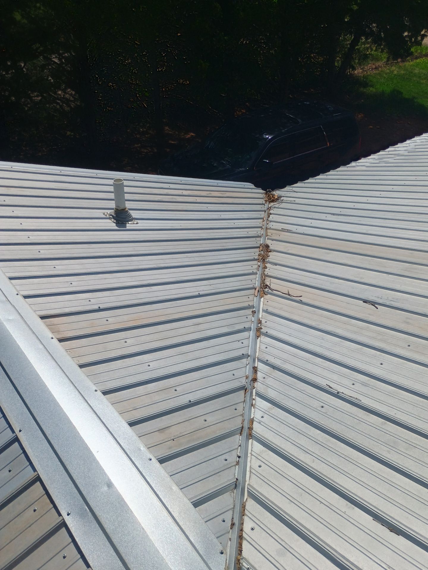 Corrugated Metal Roof Repair for Brick Home in Lindsay by BANA Roofing and Solar Supply