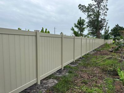Vinyl Fence Installation using Tan Vinyl Privacy Fence