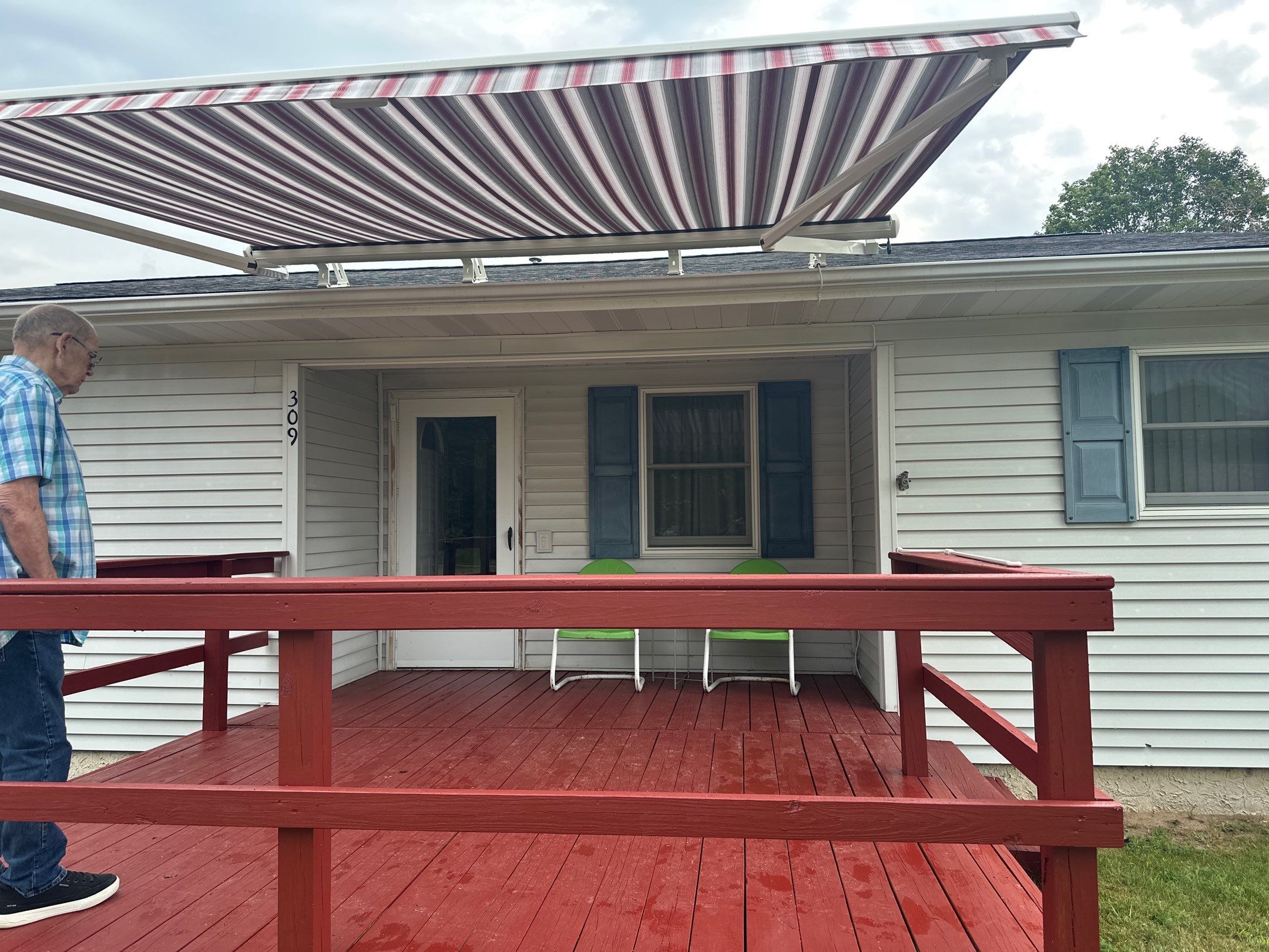 Sunesta Retractable Awning Installation for Lake City Residential Deck by Rainbow Seamless Systems