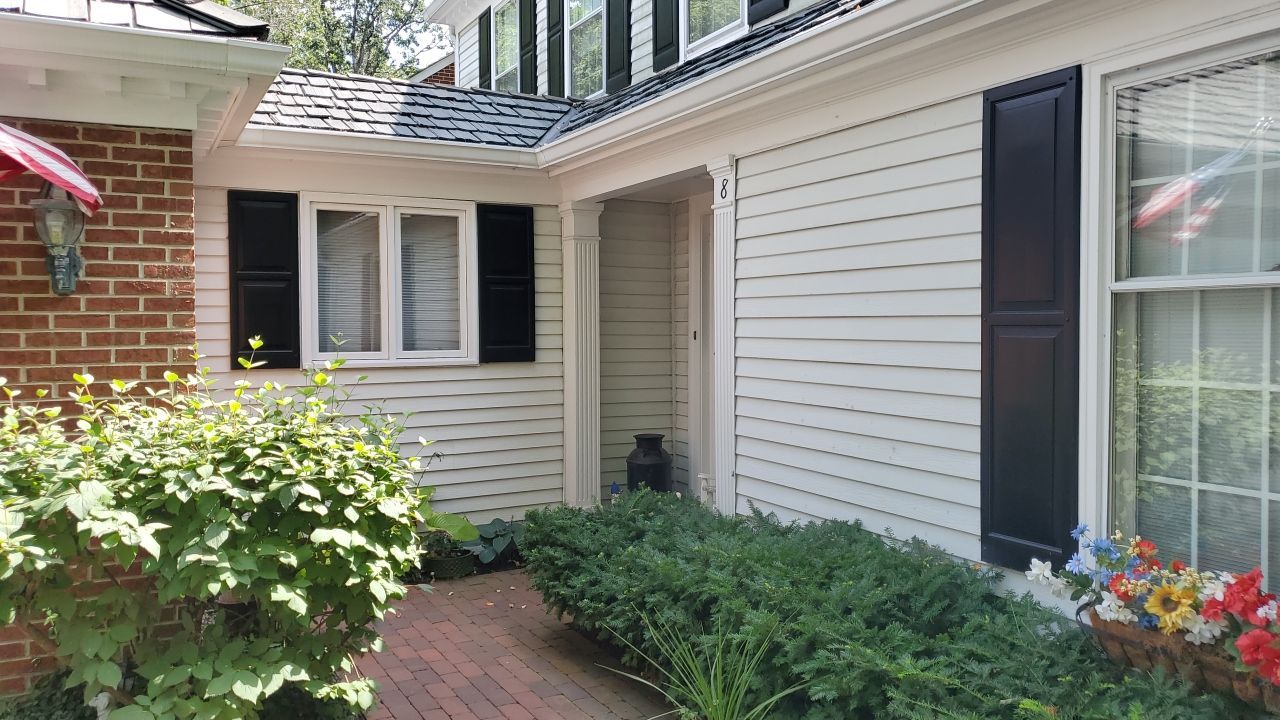 Housewashing  using Algaecide, soft wash soap by Northern Power Washing LLC.