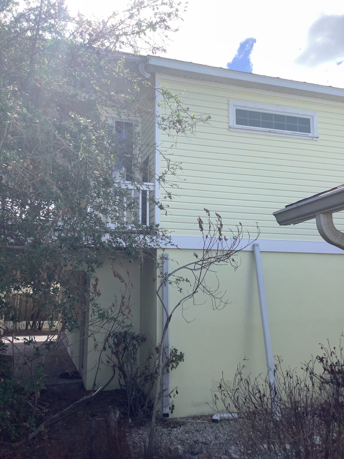 White Gutters with Matching Downspouts in Sarasota FL by Gutter Professors