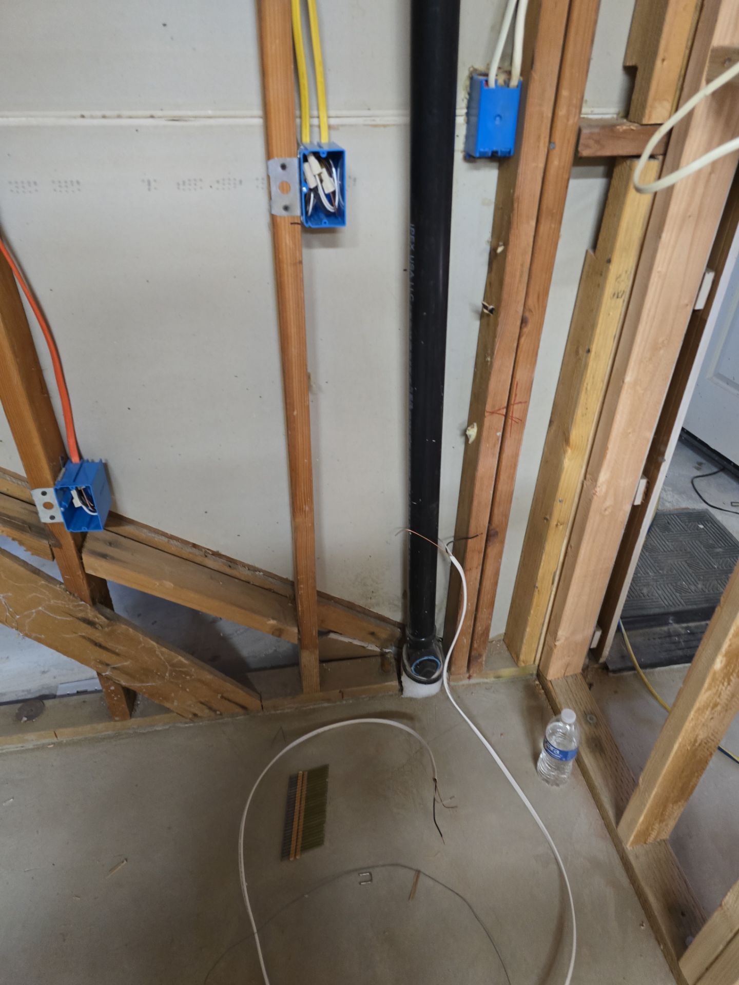 Installation of Vertical Black Piping by Us Plumbing