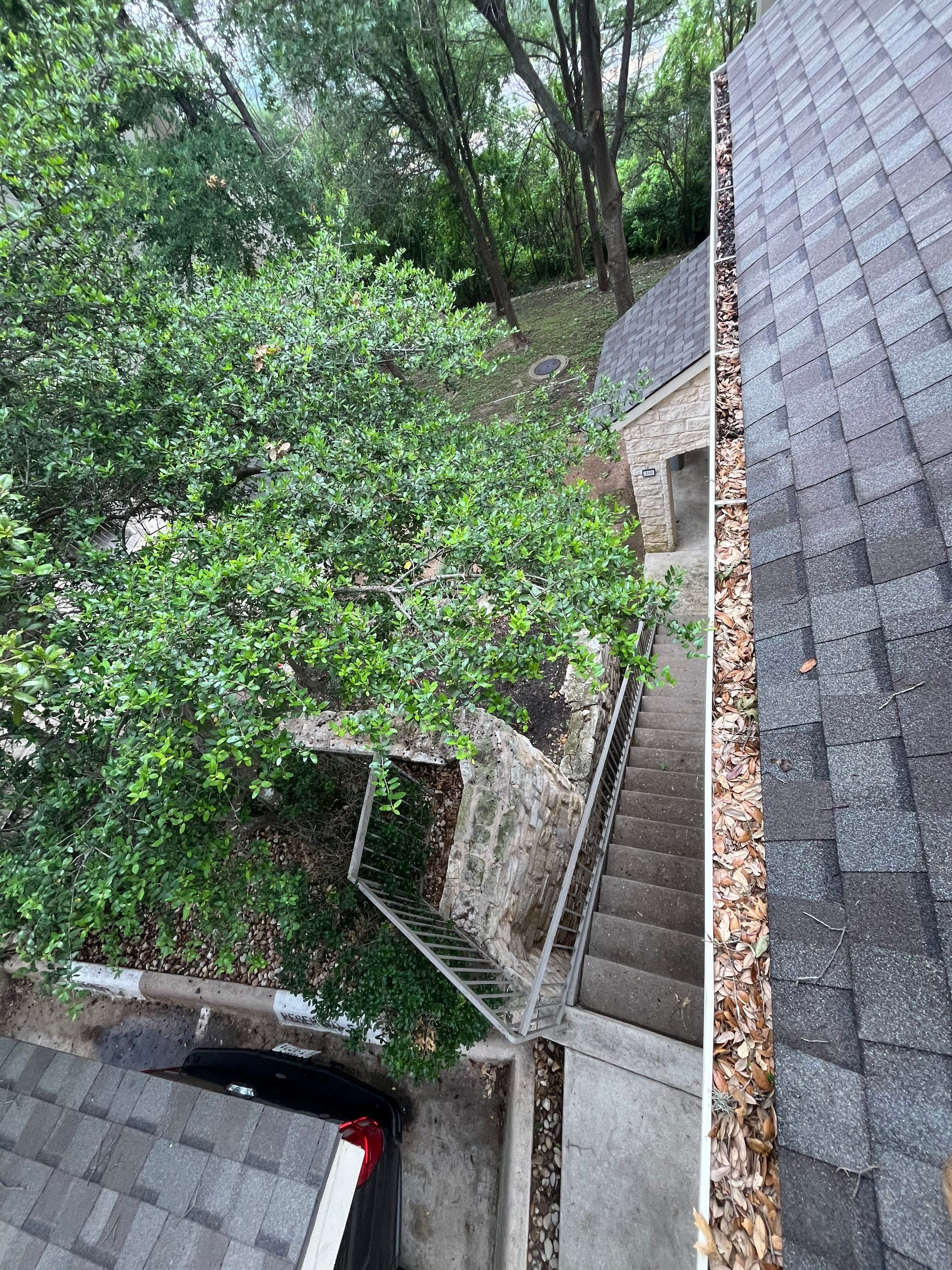Commercial gutter cleaning Round Rock & Georgetown, TX	 before photo with filled gutters