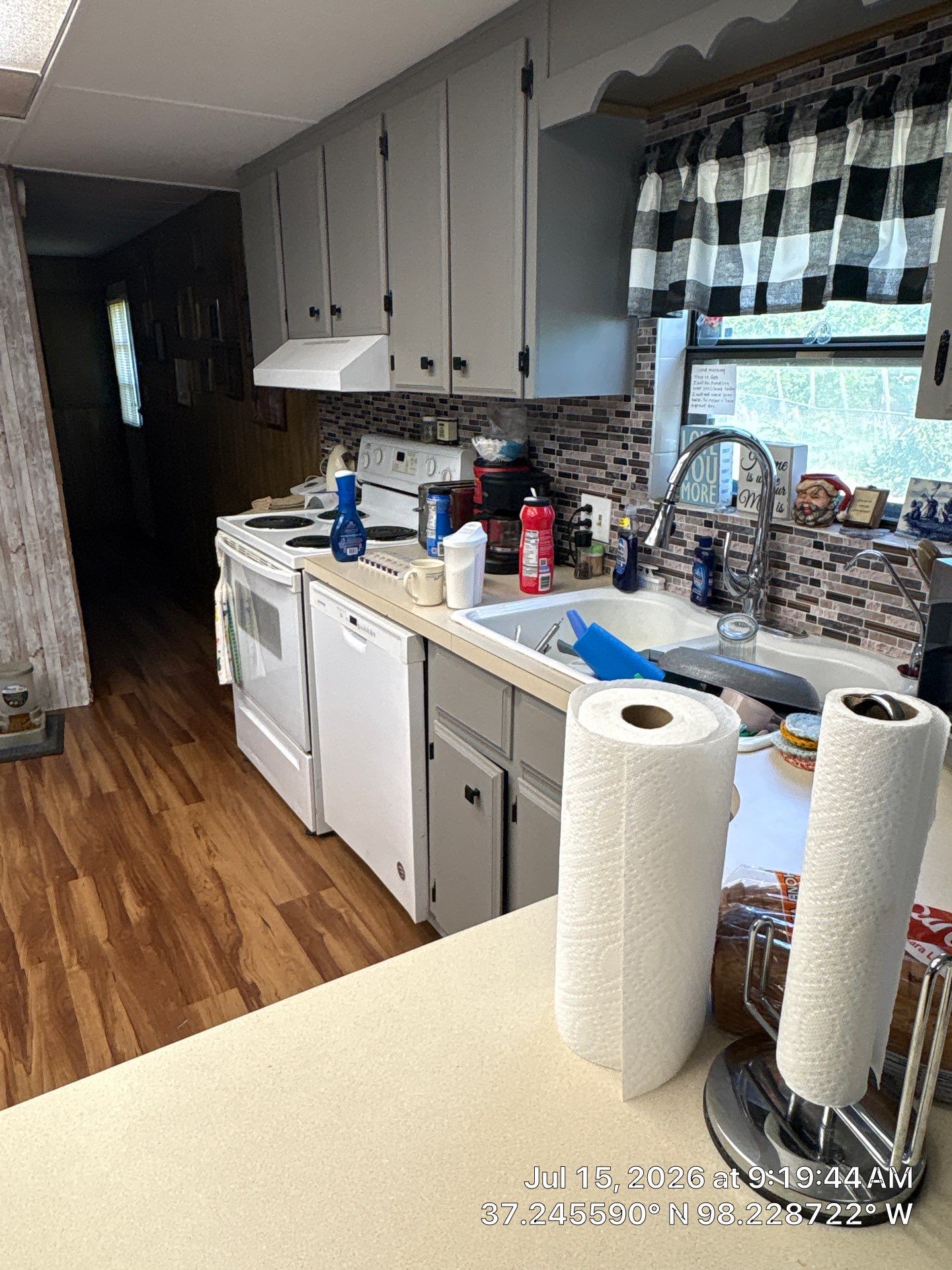 Attica Kitchen Renovation Featuring Grey Cabinetry and Wood-Look Flooring by CompanyCam Sales Demo