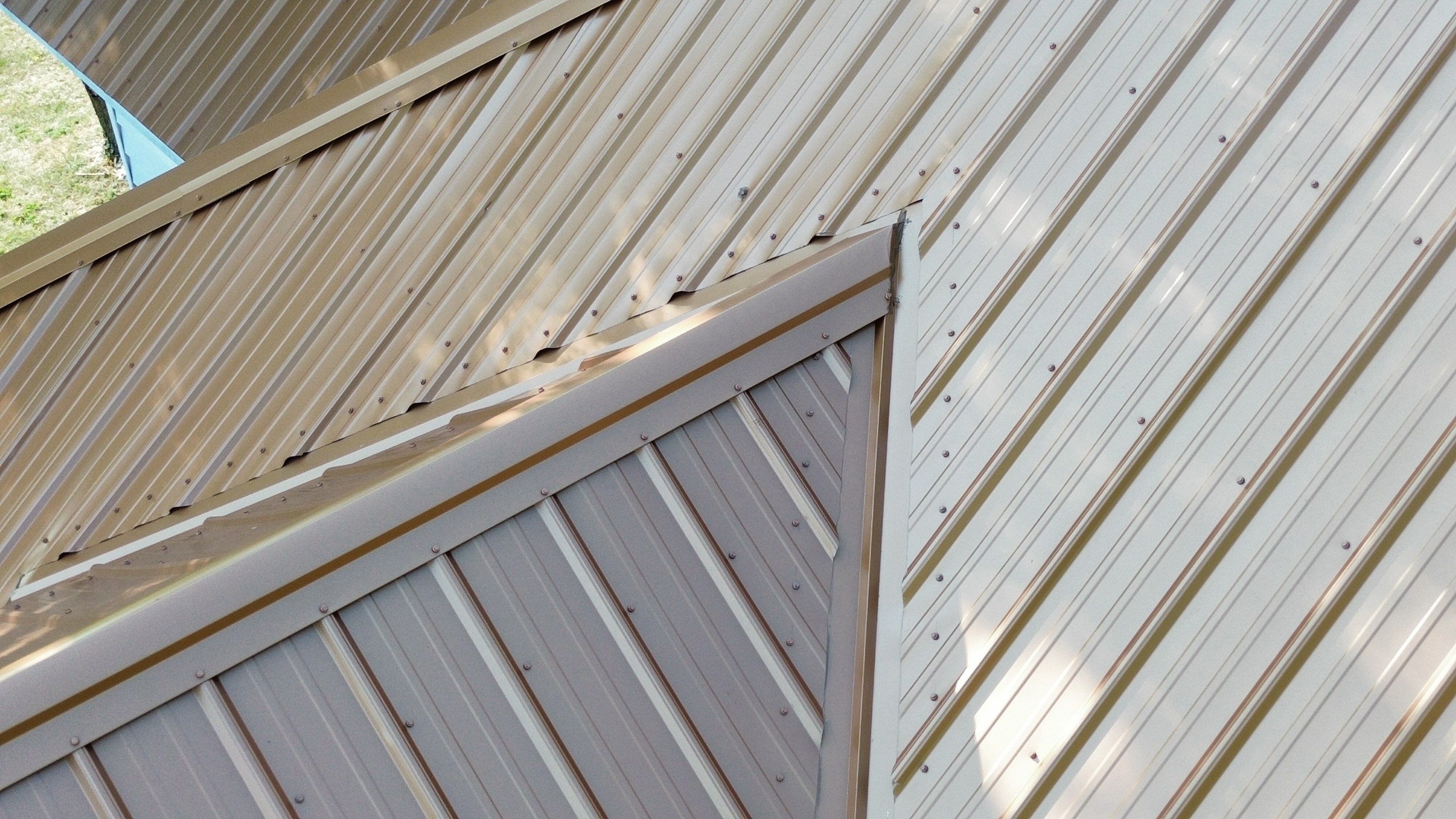 Residential Roofing Installation using Performance Panel Metal - Copper Metallic by RoofX 