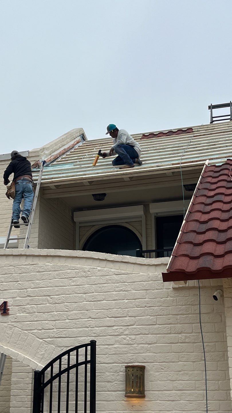 Off with the Tile and on with the TILCOR stone coated metal.  by Bayfront Roofing and Construction