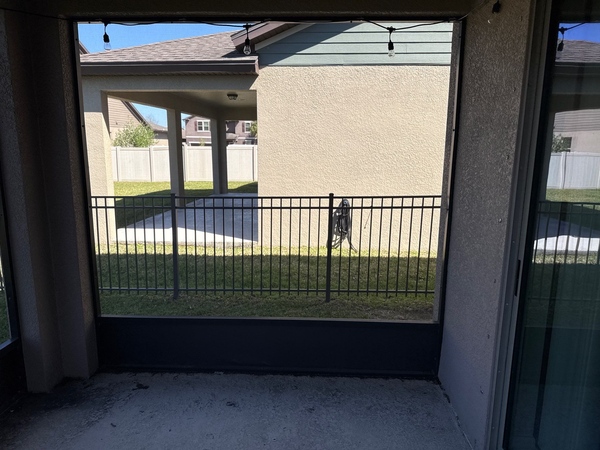 Painted Lanai Floor, Screen Enclosure, and Driveway Cleaning in Trevesta Community, Palmetto, FL by Sunshine AquaWash