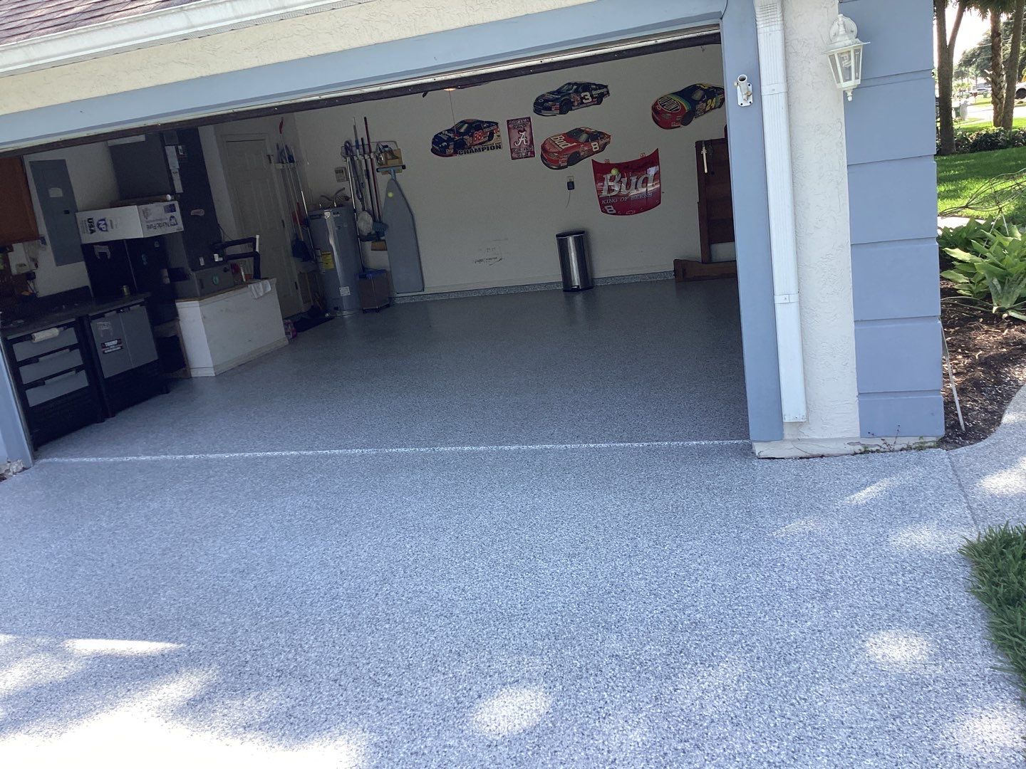 Driveway and Garage using Tidal Wave by Amvet concrete coatings llc
