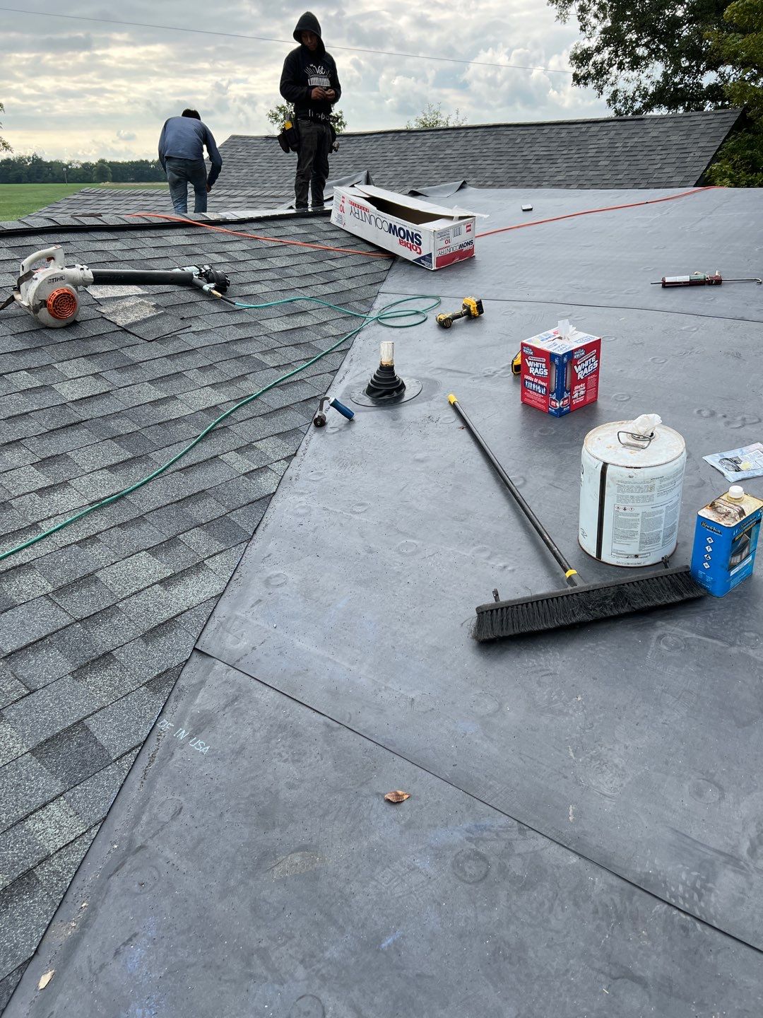 Residential Roofing Installation using 60 mil rubber roof  by Nitro Roofing and Construction
