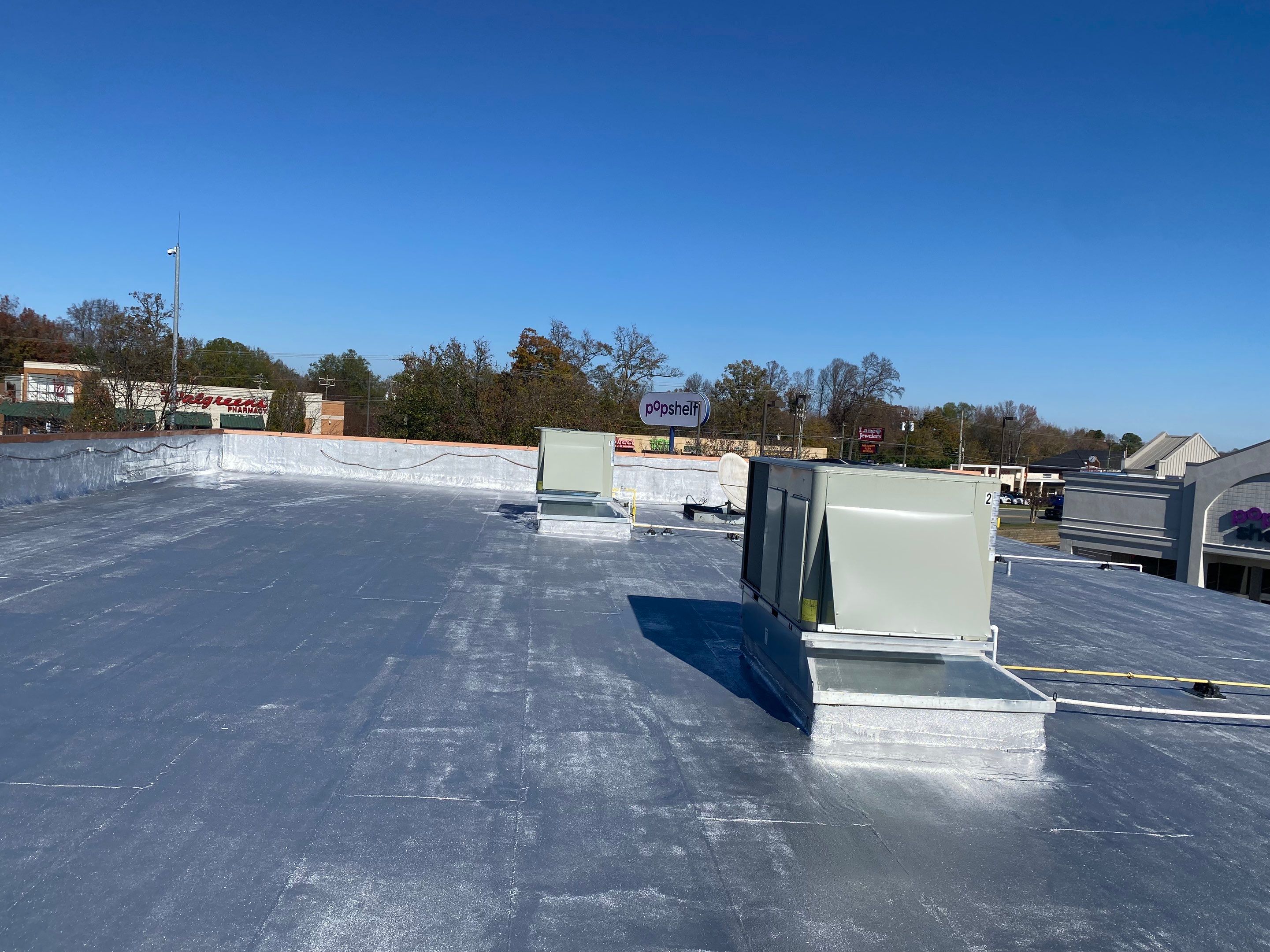 Commercial Coating using Poly Urerthane and Silicone Coating by Just In Time Roofing and Restoration