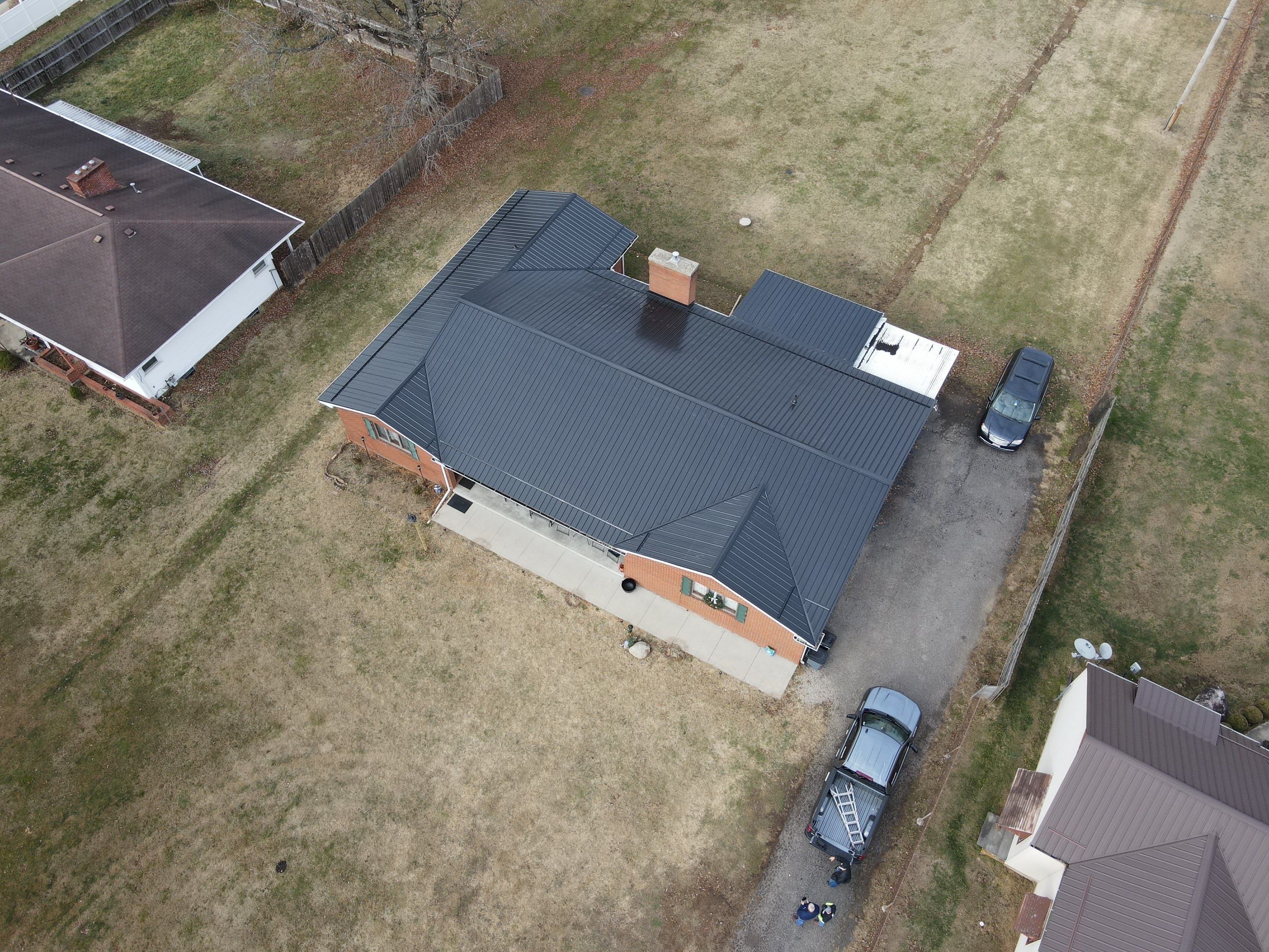 Residential Roofing Installation using Perfromance Panel Metal - Black by RoofX 