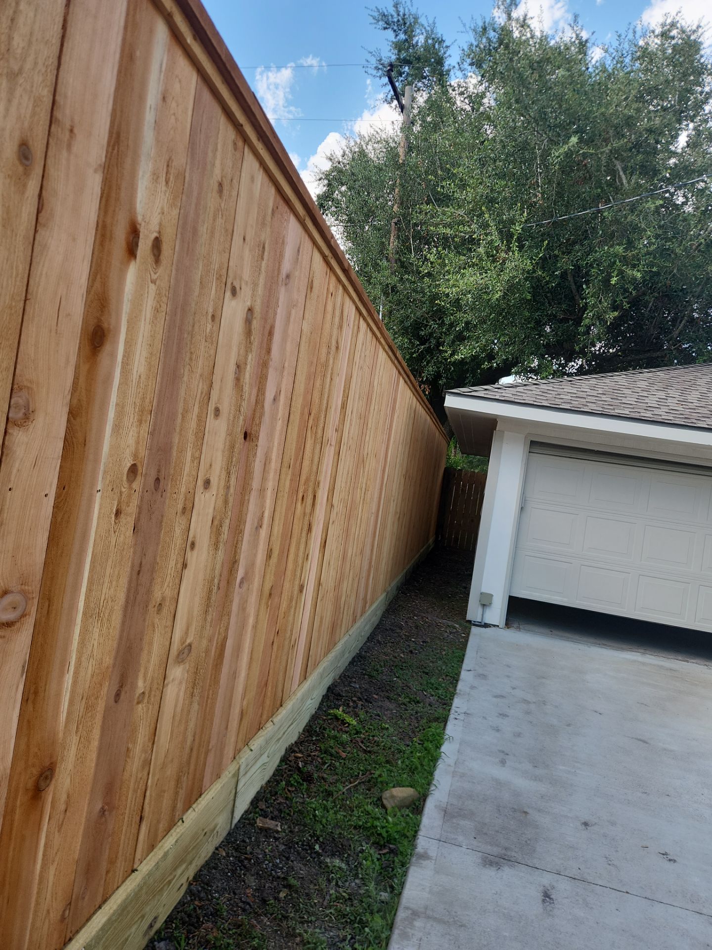 8ft Tall wood fence installation by Tim's Fences