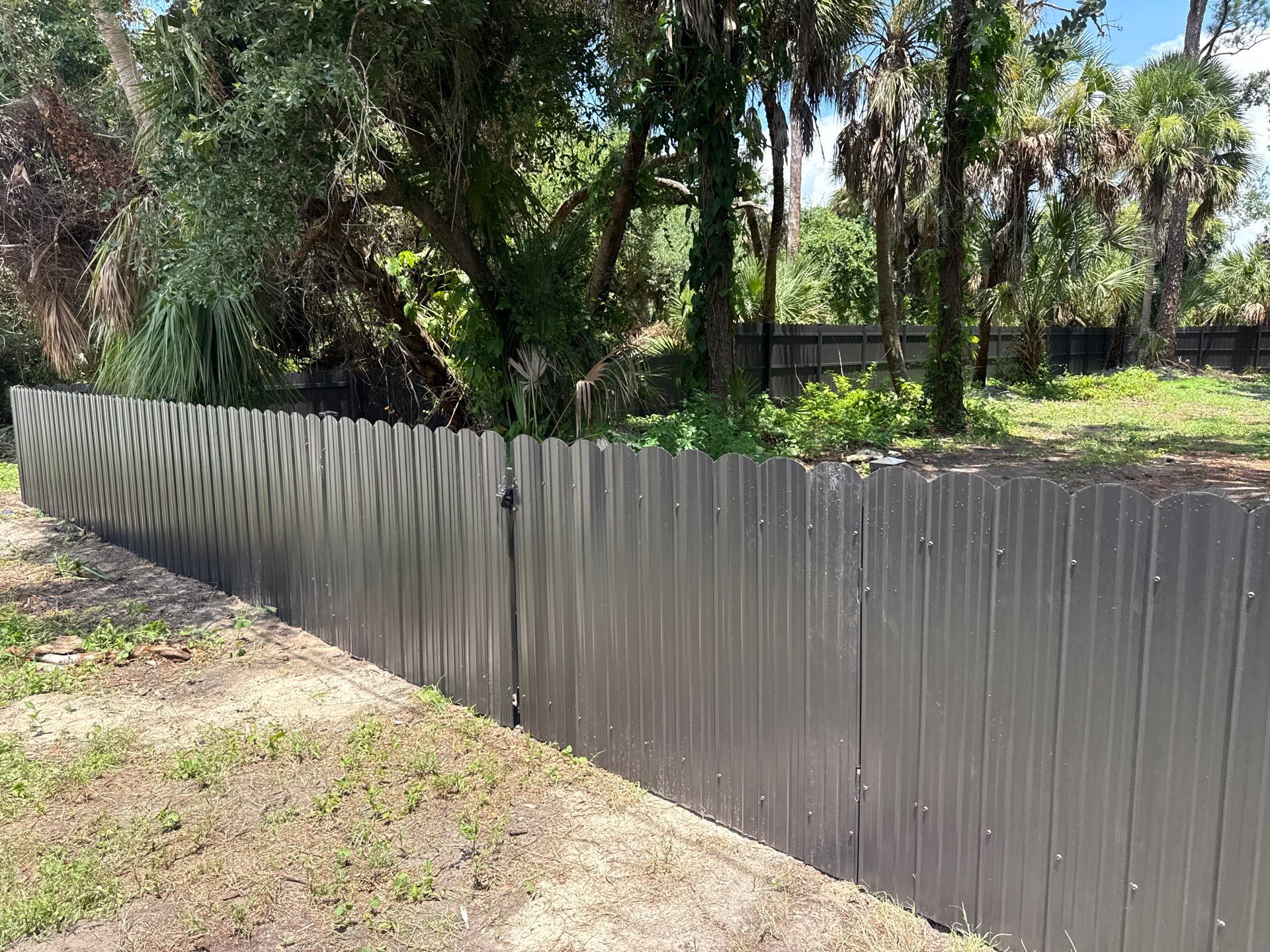 Bronze Scalloped Metal Privacy Fence Installation in North Port by True Fence LLC