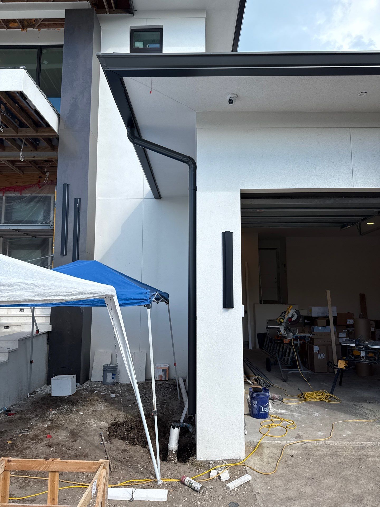 Seamless Aluminum Gutter Installation using black seamless gutters in Sarasota FL by Gutter Professors