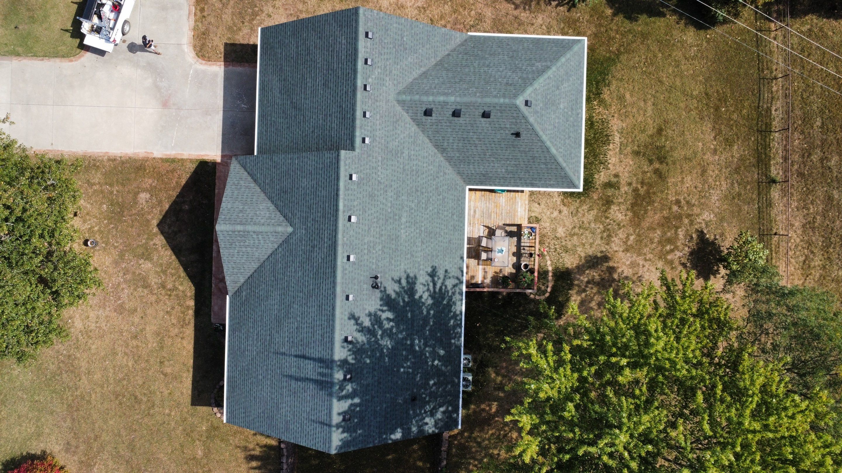 Residential Roofing Install - Green Atlas Pinnacle Pristine Shingles - White Gutters & Downspouts  by Titan Commercial & Residential Roofing 