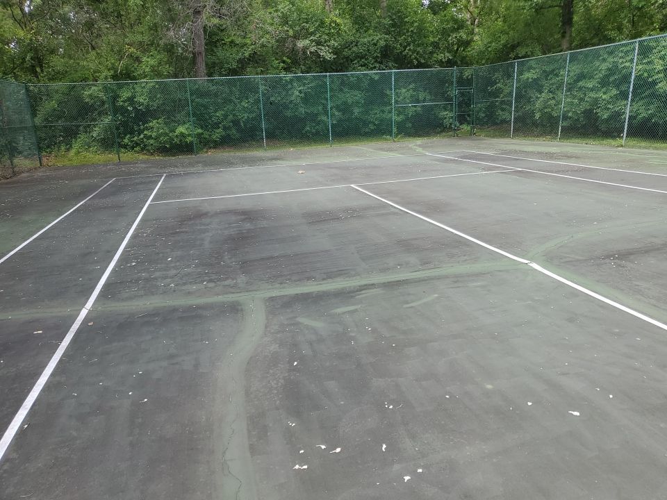 Tennis court cleaning by Northern Power Washing LLC.