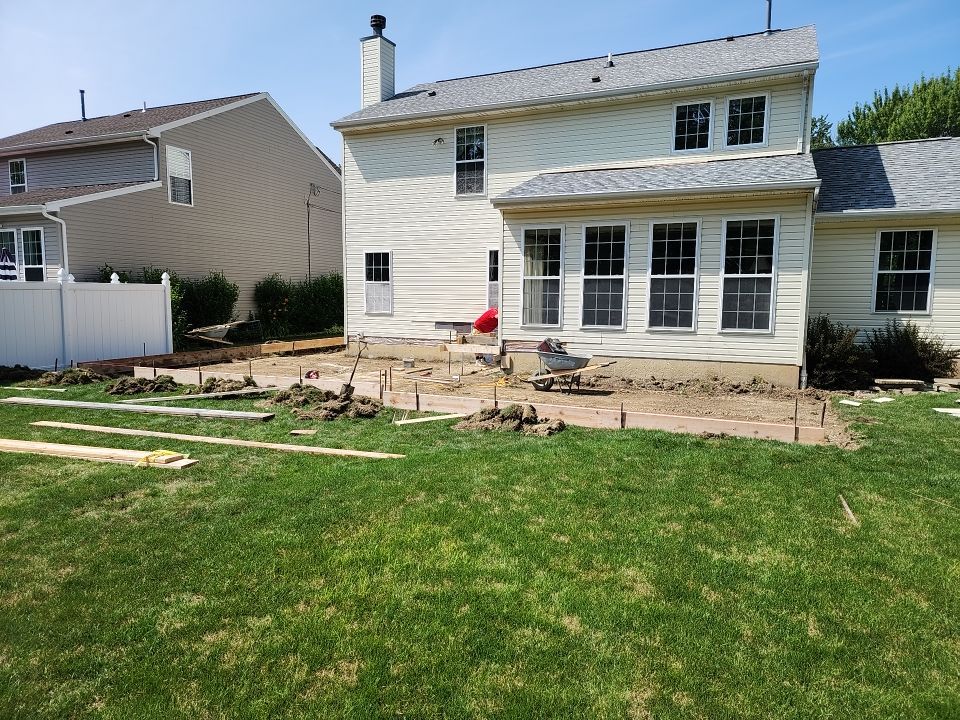 Stamped Concrete, Entry Door, and Concrete  by Ivy Lea Construction