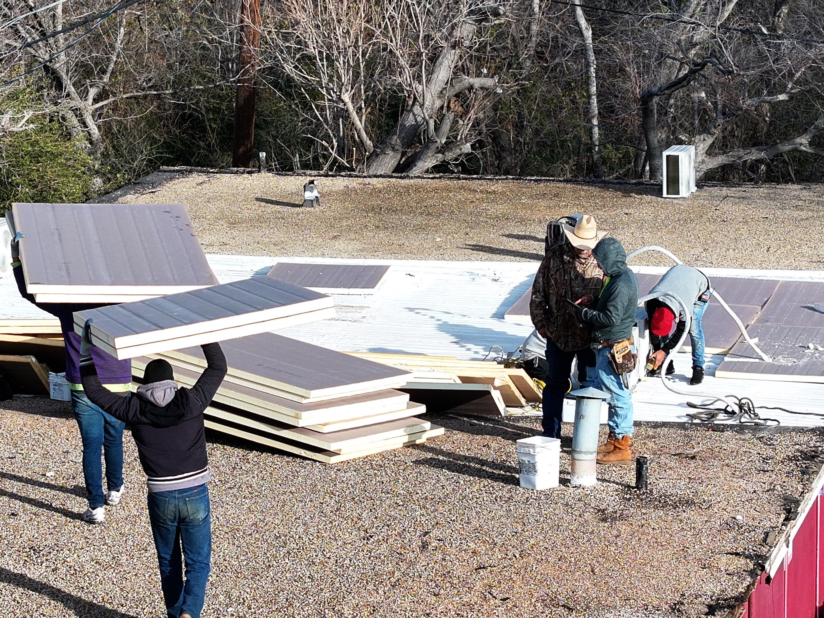 Commercial roofing overlay using GAF TPO over an old ballast roof by Becker Roofing and Exteriors